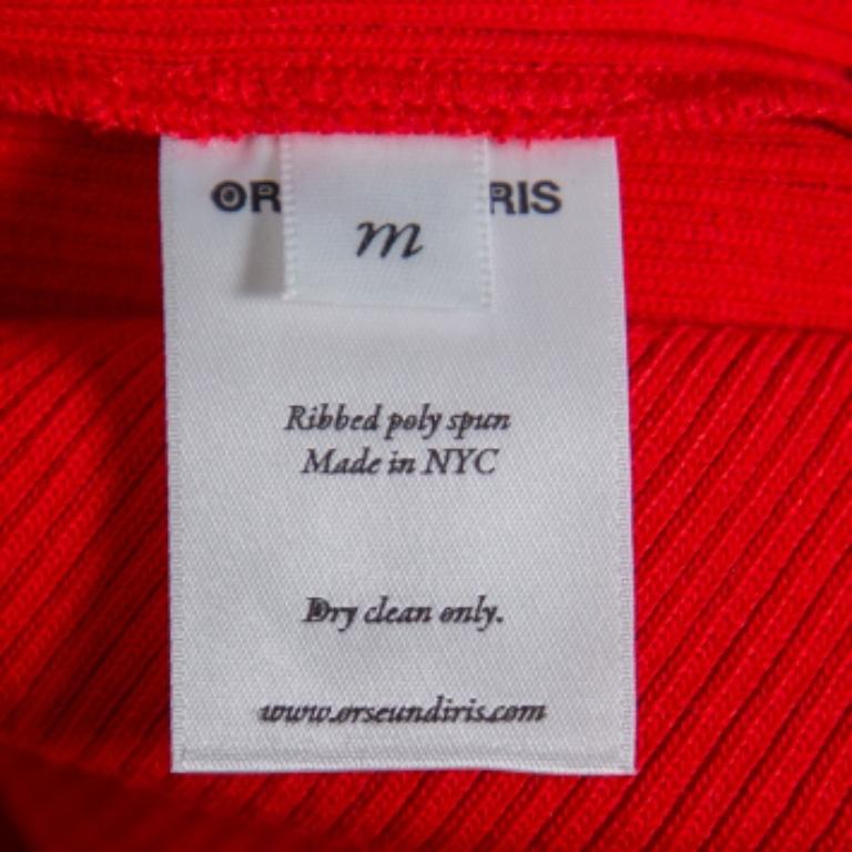 An off-shoulder crop top by Orseund Iris made from stretch fabric and featuring underwire details, long sleeves with slit, and frayed edges. In the label's words: This is an original, just like you.