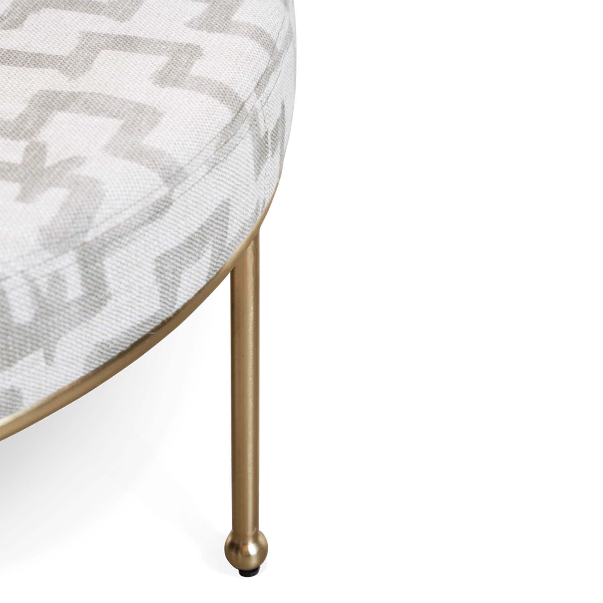 Satin Brass Orsini ottoman by Lawson-Fenning. The Orsini Ottoman features a brushed brass base with cap feet and an upholstered seat. Shown here with satin brass base and upholstered in Zak + Fox 