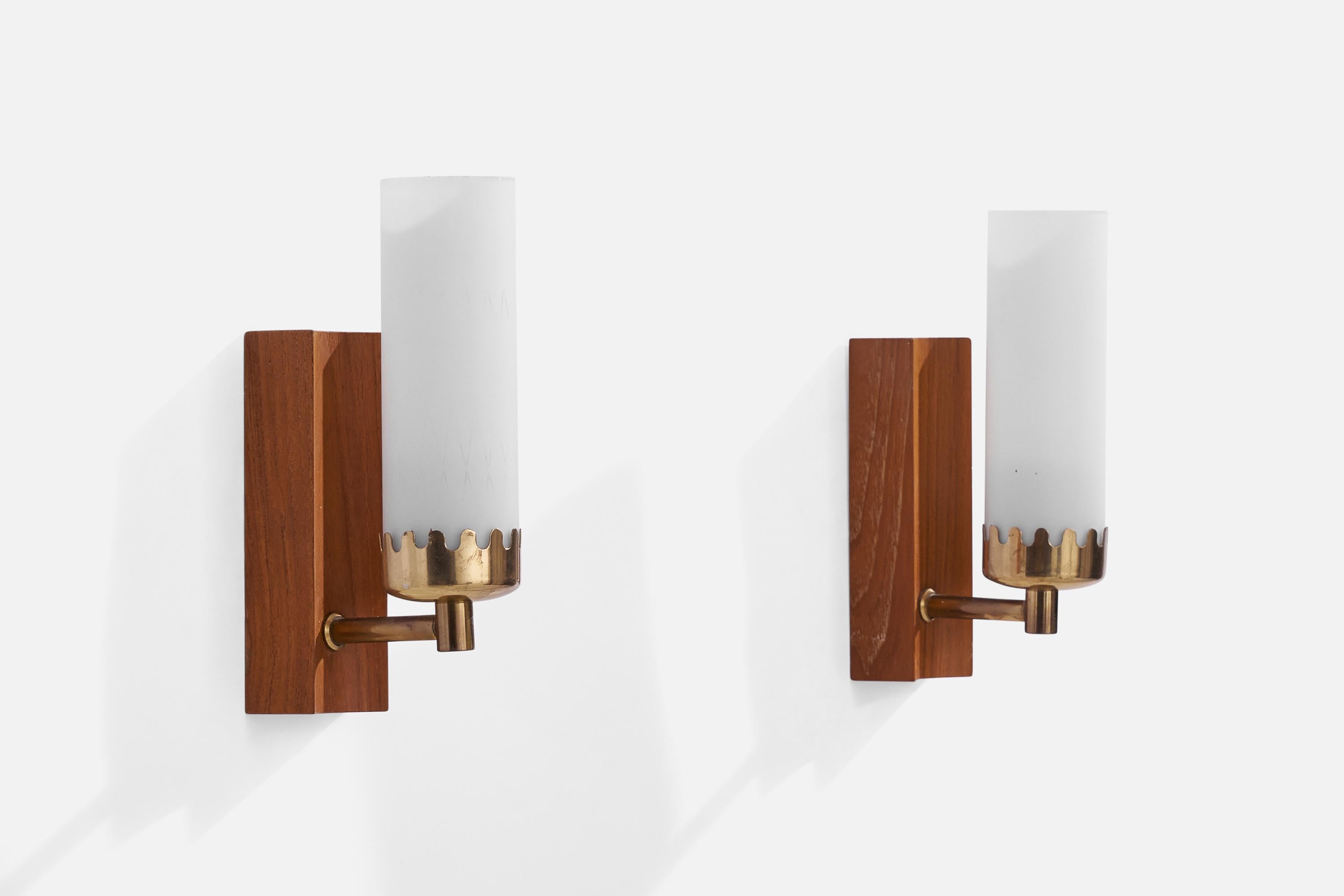 A pair of teak, brass and opaline glass wall lights designed and produced by Örsjö Industri, Sweden, 1950s.

Overall Dimensions (inches): 7.5”  H x 2” W x 4” D
Back Plate Dimensions (inches): 5.50” H x 2” W x 1.1” D
Bulb Specifications: E-14