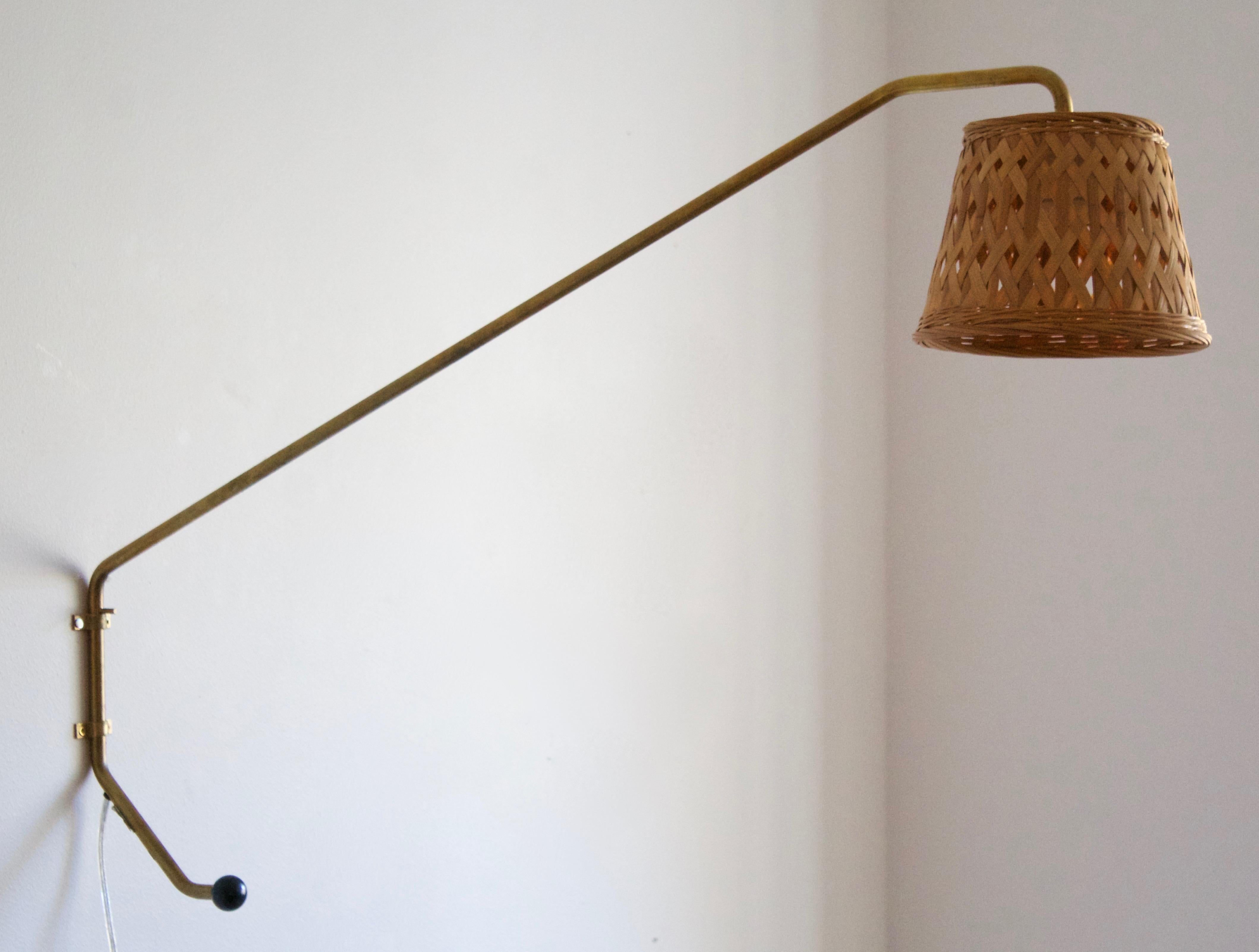 A sizeable wall light, designed and produced by Orsjö site specific for an Architecture Company head office, Sweden, 1980s. Labeled. Assorted vintage rattan lampshade.

Takes one lightbulb on E27 base. Max wattage of 60W, stated on fixture.

  