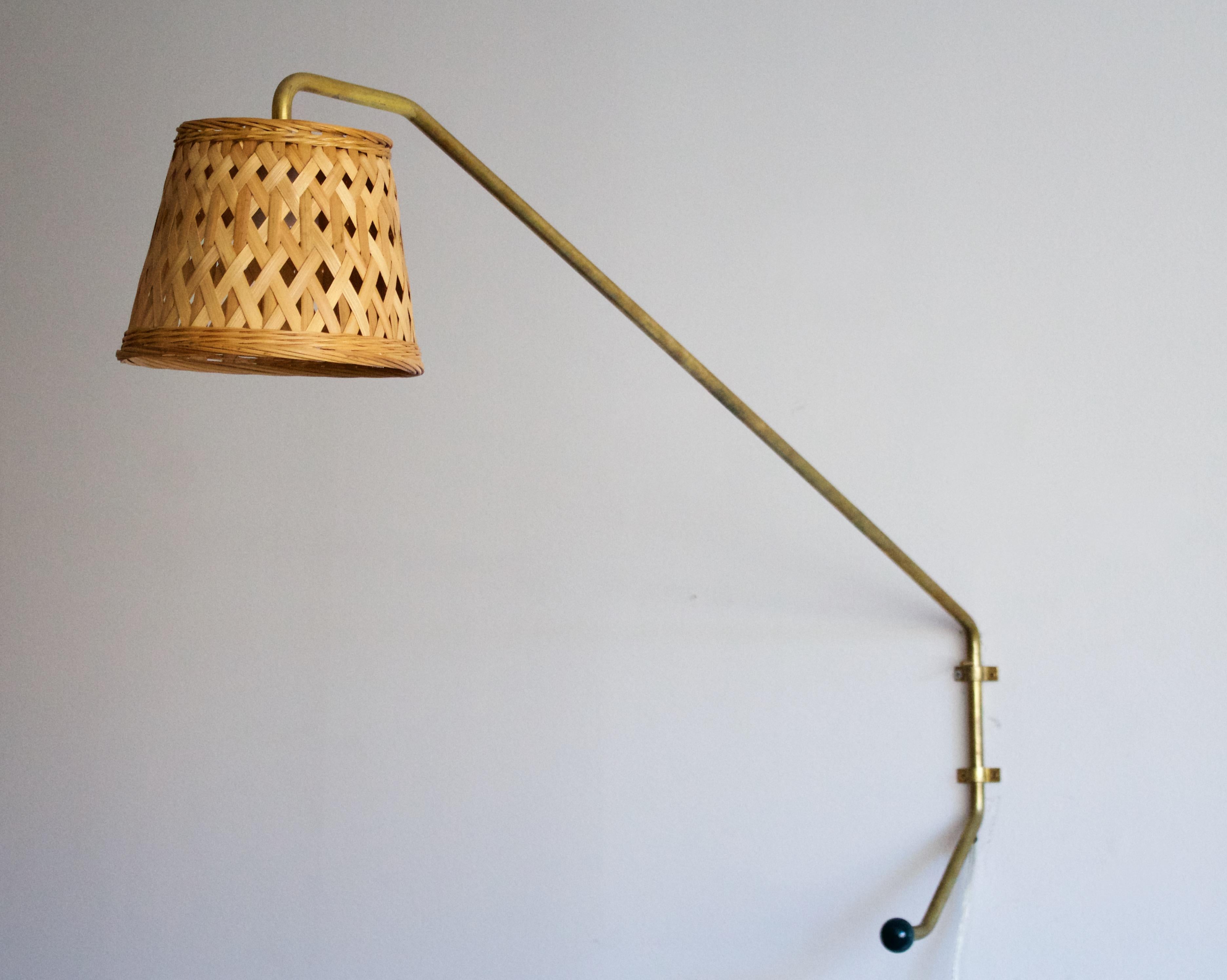 A pair of sizeable wall lights, designed and produced by Orsjö site specific for an Architecture Company head office, Sweden, 1980s. Labeled. Assorted vintage rattan lampshades.

Takes one lightbulb on E27 base. Max wattage of 60W, stated on
