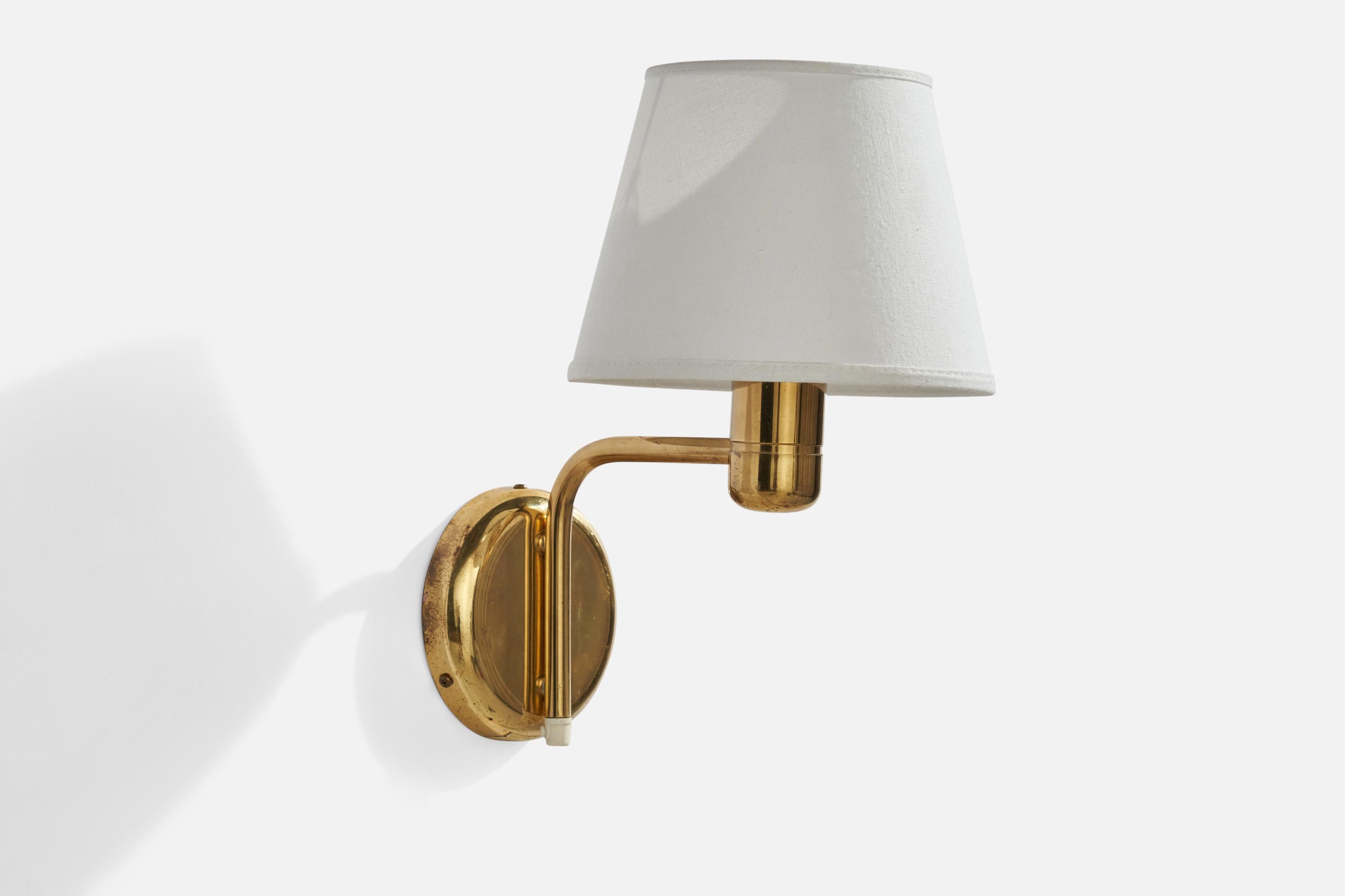 A brass and white fabric wall light designed and produced by Örsjö Industri, Sweden, c. 1970s.

Overall Dimensions (inches): 13.5” H x 8” W x 11” D
Back Plate Dimensions (inches): 5”  H x 5” W x 1” D
Bulb Specifications: E-26 Bulb
Number of Sockets: