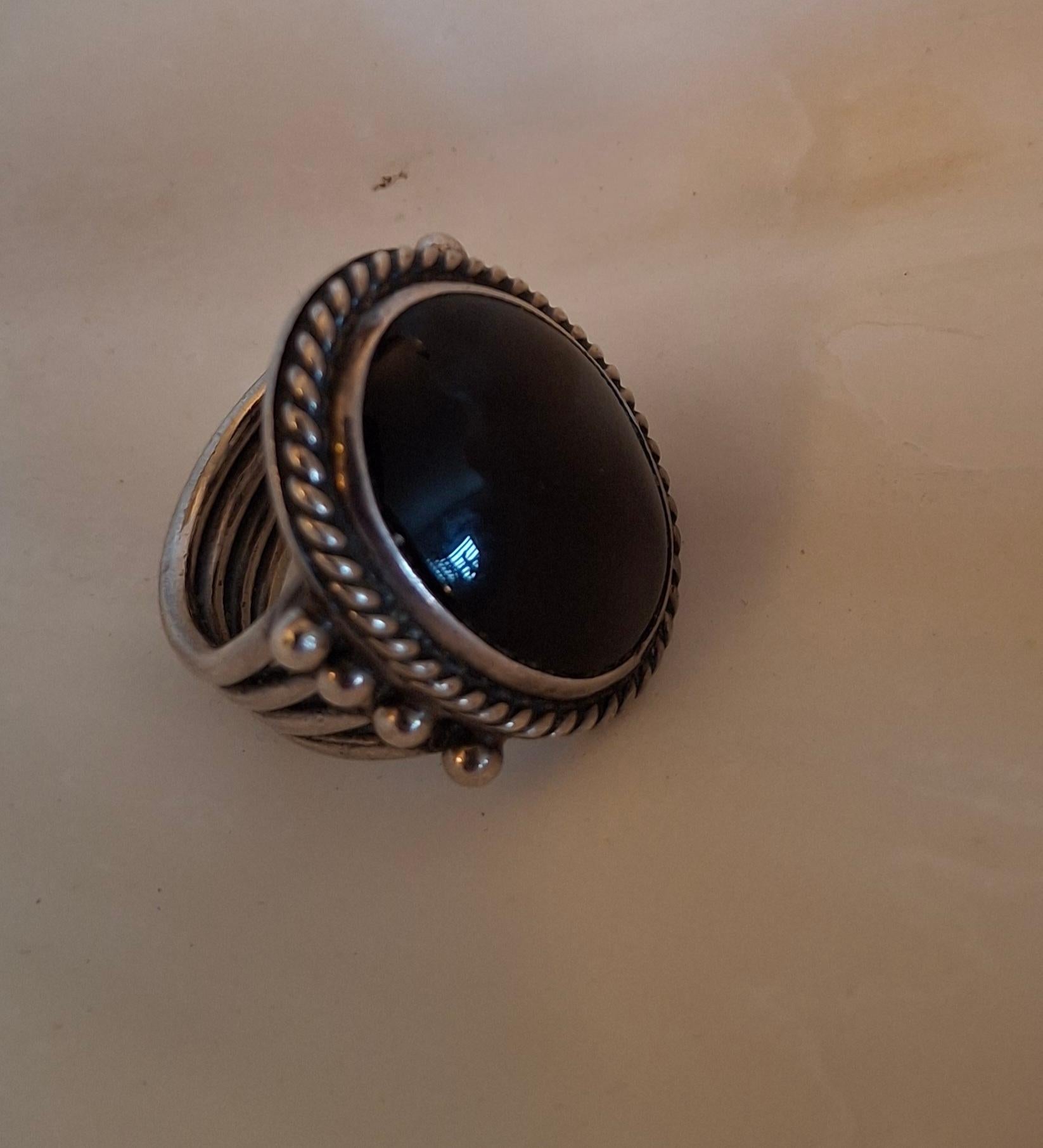 Orville Tsinnie Navajo Onyx and Sterling Ring

1 3/8 x 1