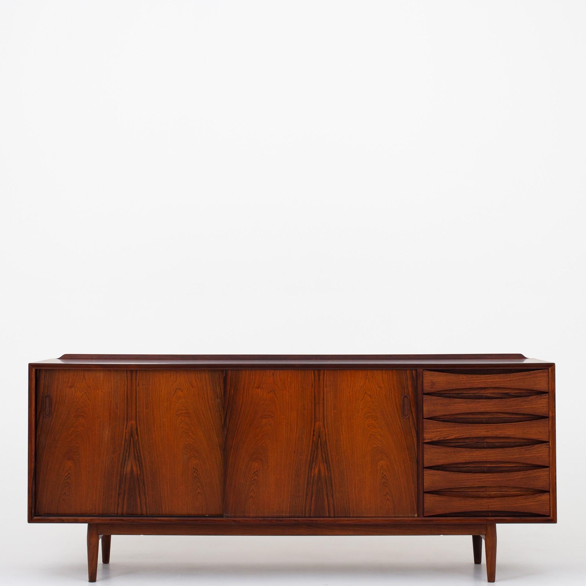 OS 63 - Sideboard in rosewood w. coloured, reversible doors. Designed in 1958. Maker Sibast.