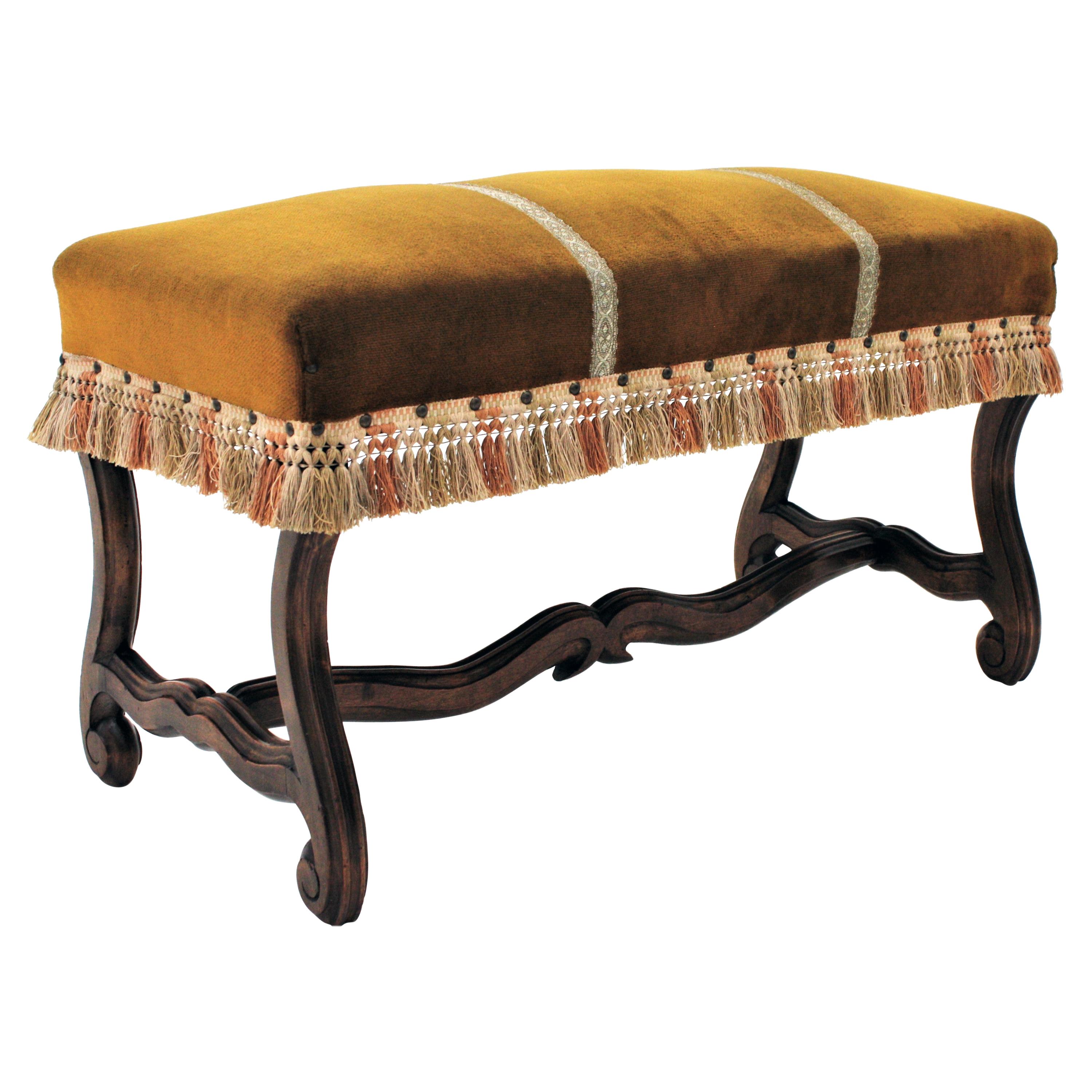 Louis XIV style Os de Mouton legs bench in velvet upholstery with Fringe, France, 1930s
An early 20th century backless Louis XIV style bench or stool raised on four Os de Mouton hand carved walnut wood legs with stretcher.
This stylish banquette