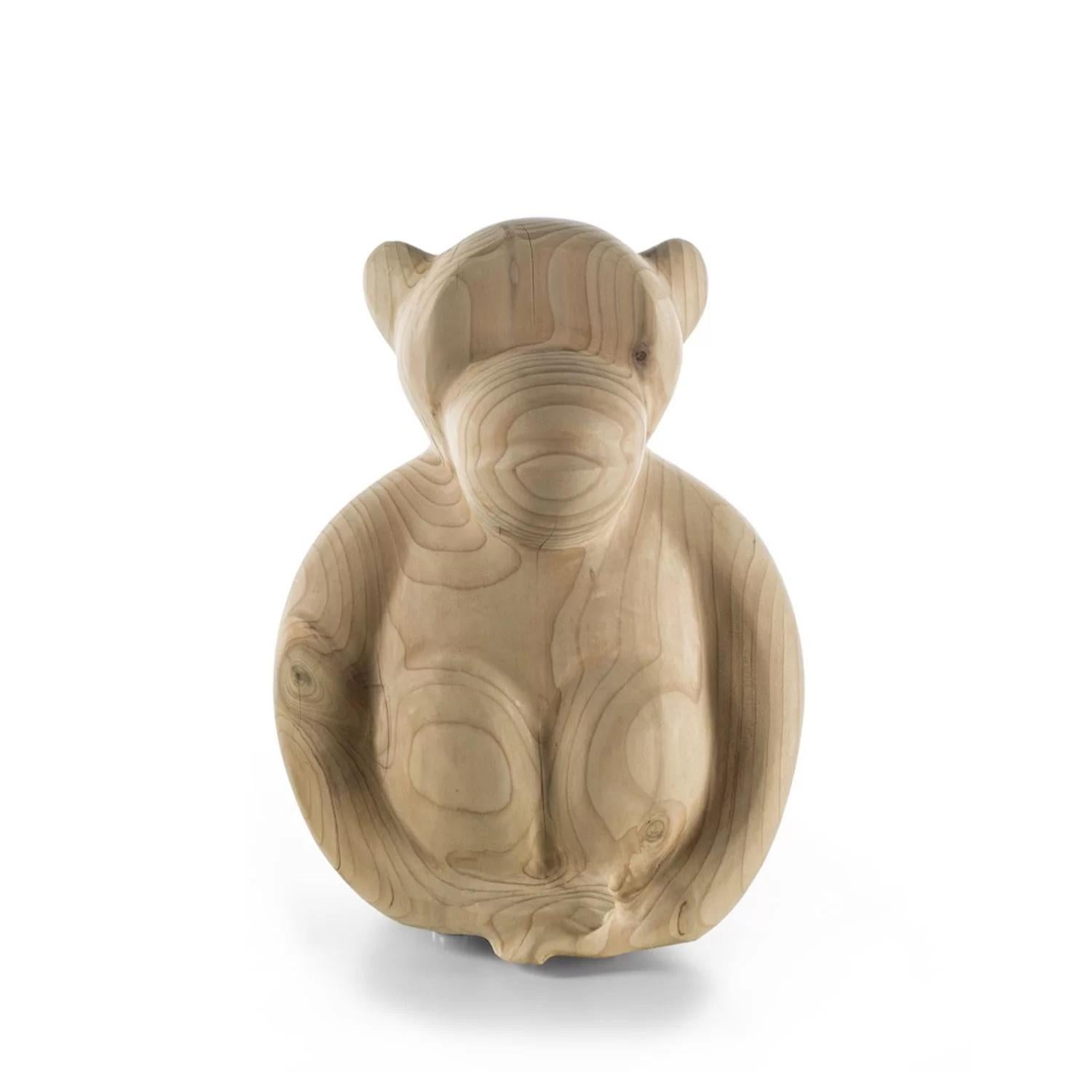Solid wood accessory in scented Cedar made from one single block of wood, with a sculptural design inspired by a funny little monkey. Available in three sizes: big, medium and small

