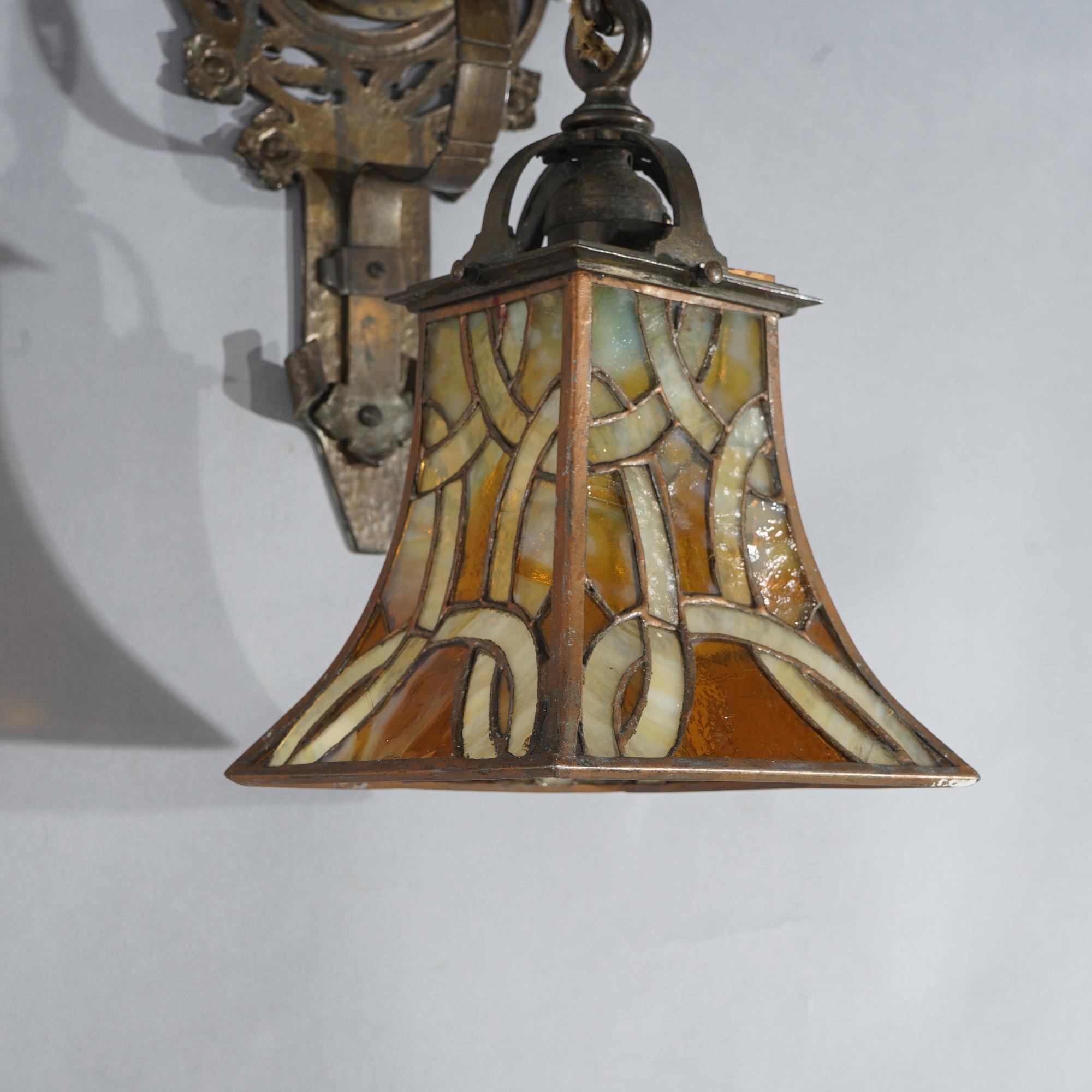 American Oscar Bach Arts & Crafts Figural Hammered Bronze & Leaded Glass Wall Sconces For Sale