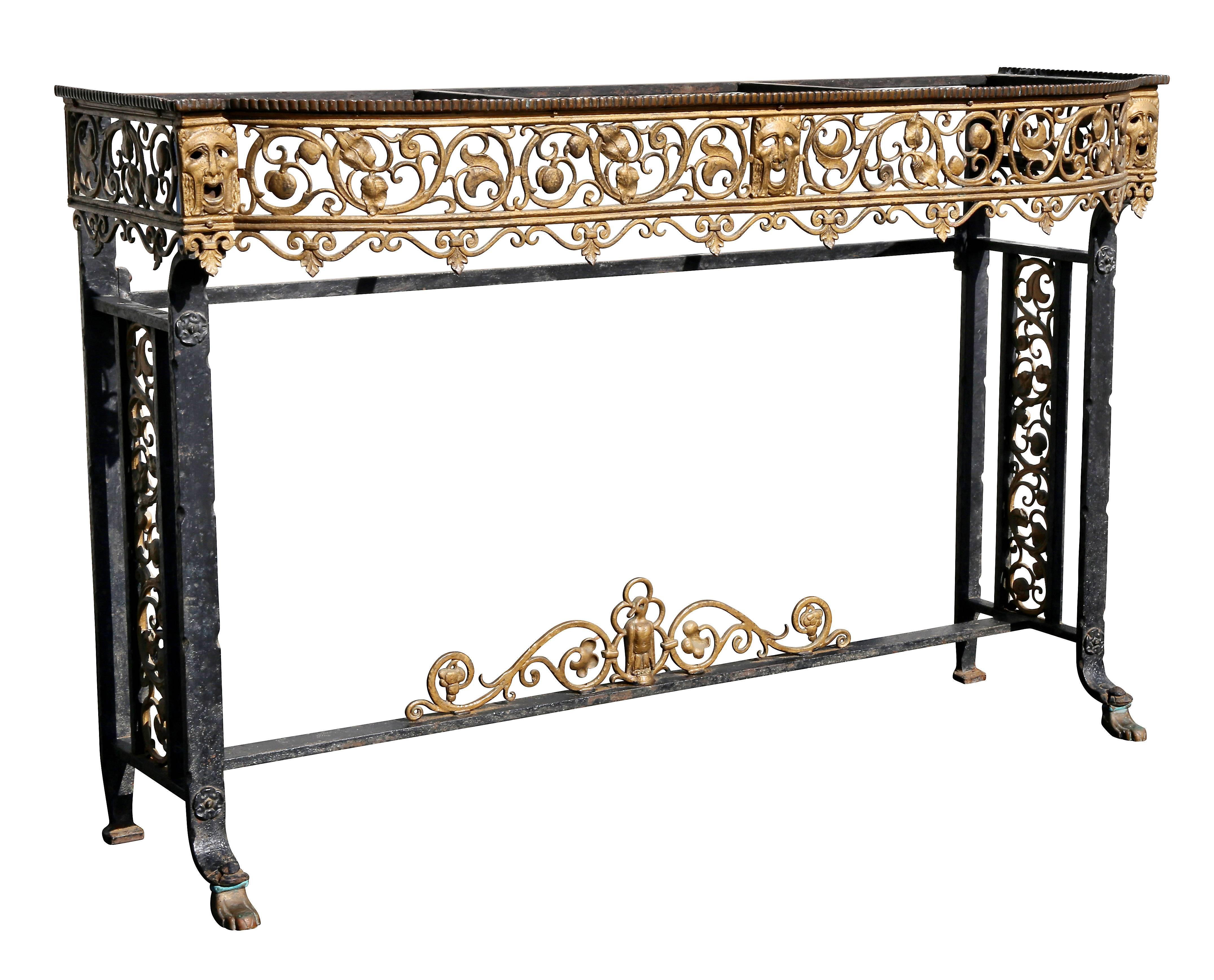 With color of choice marble top set in a rectangular top with rounded ends, the frieze with comedy and tragedy masks with pierced arabesques raised on black painted wrought iron legs joined by a stretcher with bird motif, sides similarly decorated.