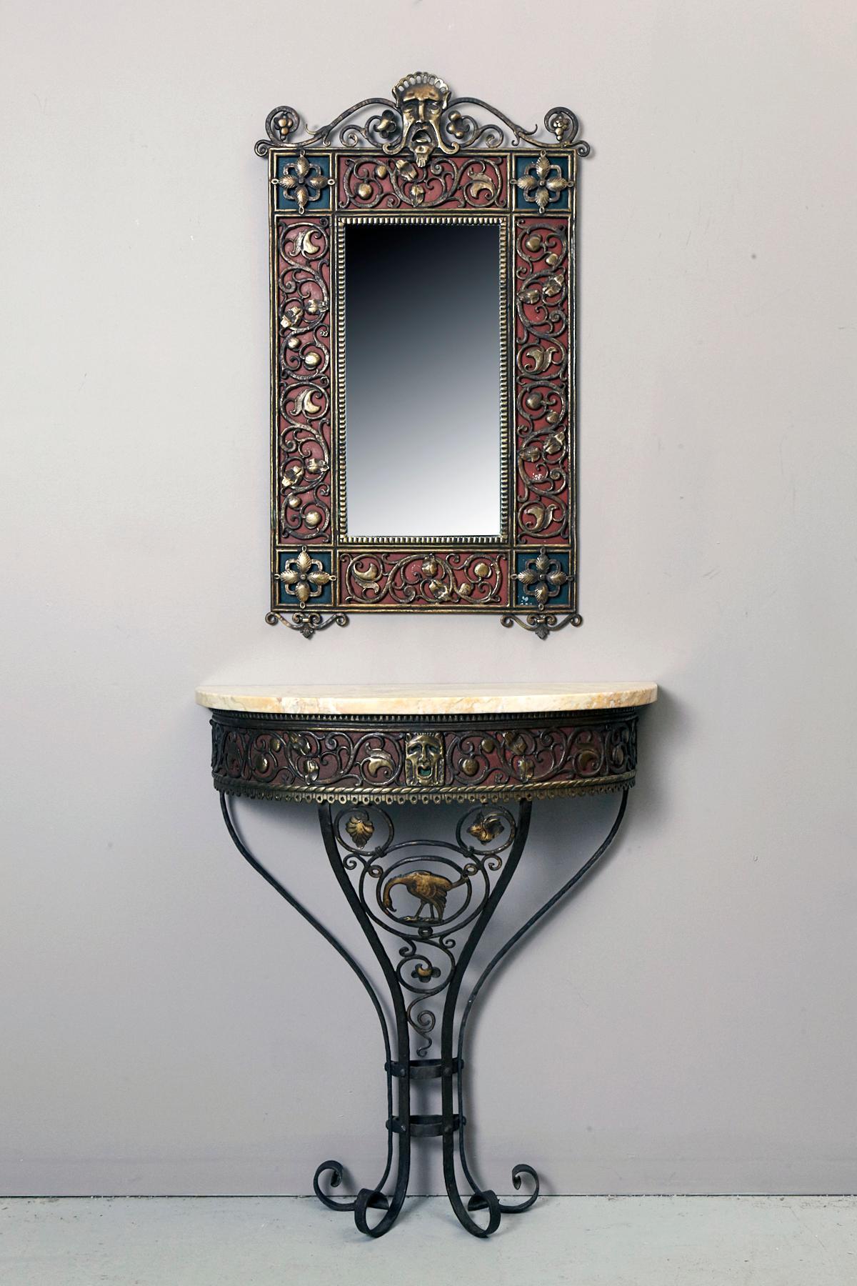 Italianate mirror and console set designed and manufactured by Oscar Bach, 1923.
Copper alloy with dark brown chemical patina, glass, lacquer, tinned sheet metal.

The mirror is referenced in on the official Oscar Bach website in the category