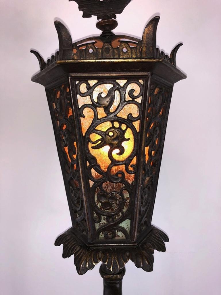 A pair of gothic style lamps from the early 20th Century designed by Oscar Bach and produced by Bertram Segar. These torchieres are made from bronze and brass. Single standard bulb socket with pull chain switch.
 
Measures: 14W 12.5D 72H
 
Good
