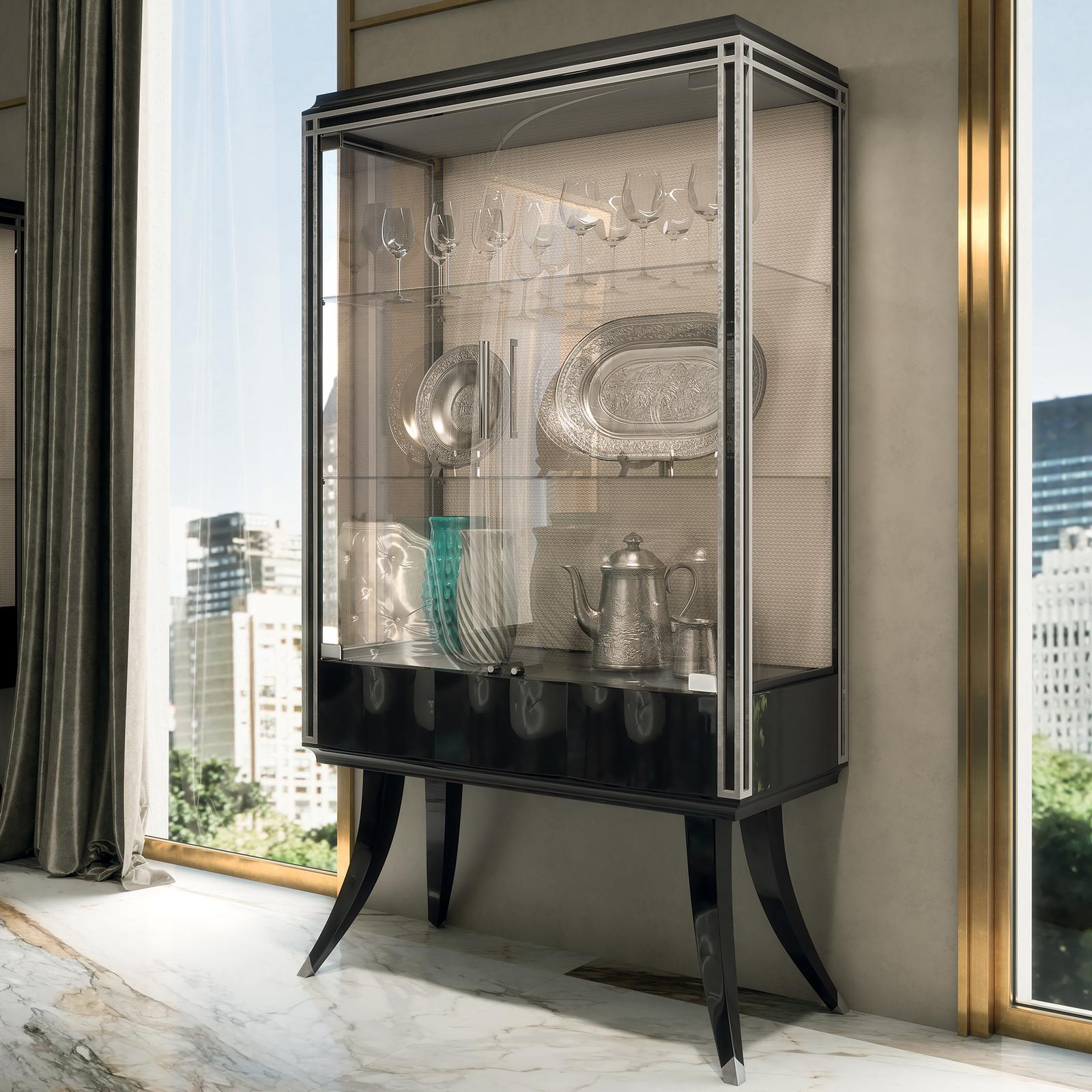 This spectacular Cabinet features 2 doors and 1 drawer with push pull blumotion, tempered glasses and led lights. Crafted in santos rosewood, the attractive design of the entire new Oscar Collection adapts to any setting with a contemporary,