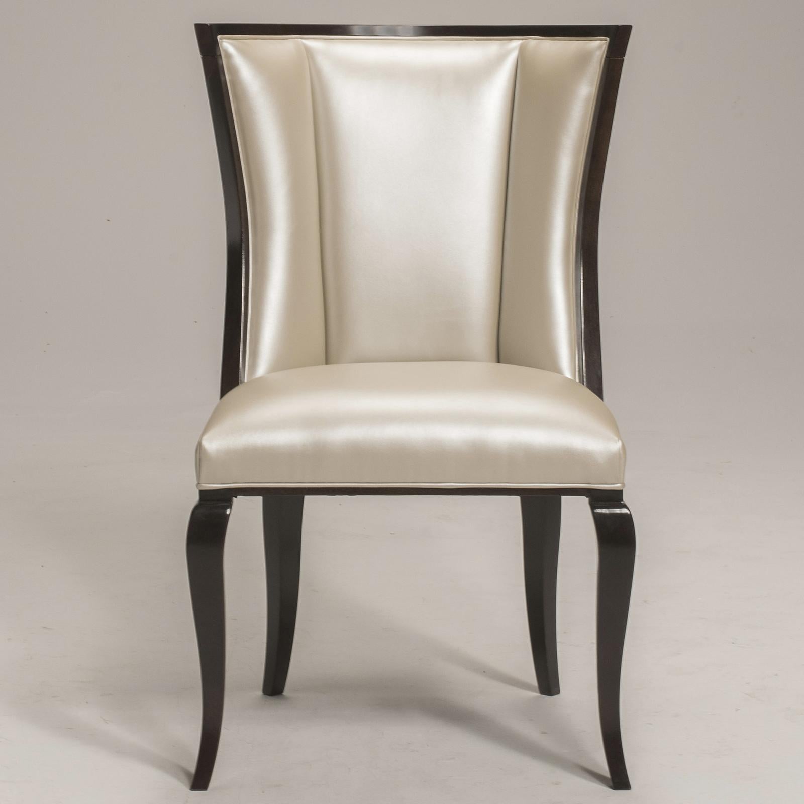 A luxuriously delightful addition to any decor in the home with an elegant and cosmopolitan flavor, this Oscar Collection Chair combines tradition and modernity with deluxe elements in wood and fabric of superb quality. The stunning beige-toned