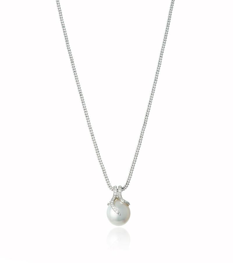 The Statement Pearl pendant features a large South Sea 11-13 mm White Cultured pearl beautifully situated in a sparkling diamond wrap claw setting.

Versatile styling with this piece from a Black Tie Event to a simple elegant white shirt, this