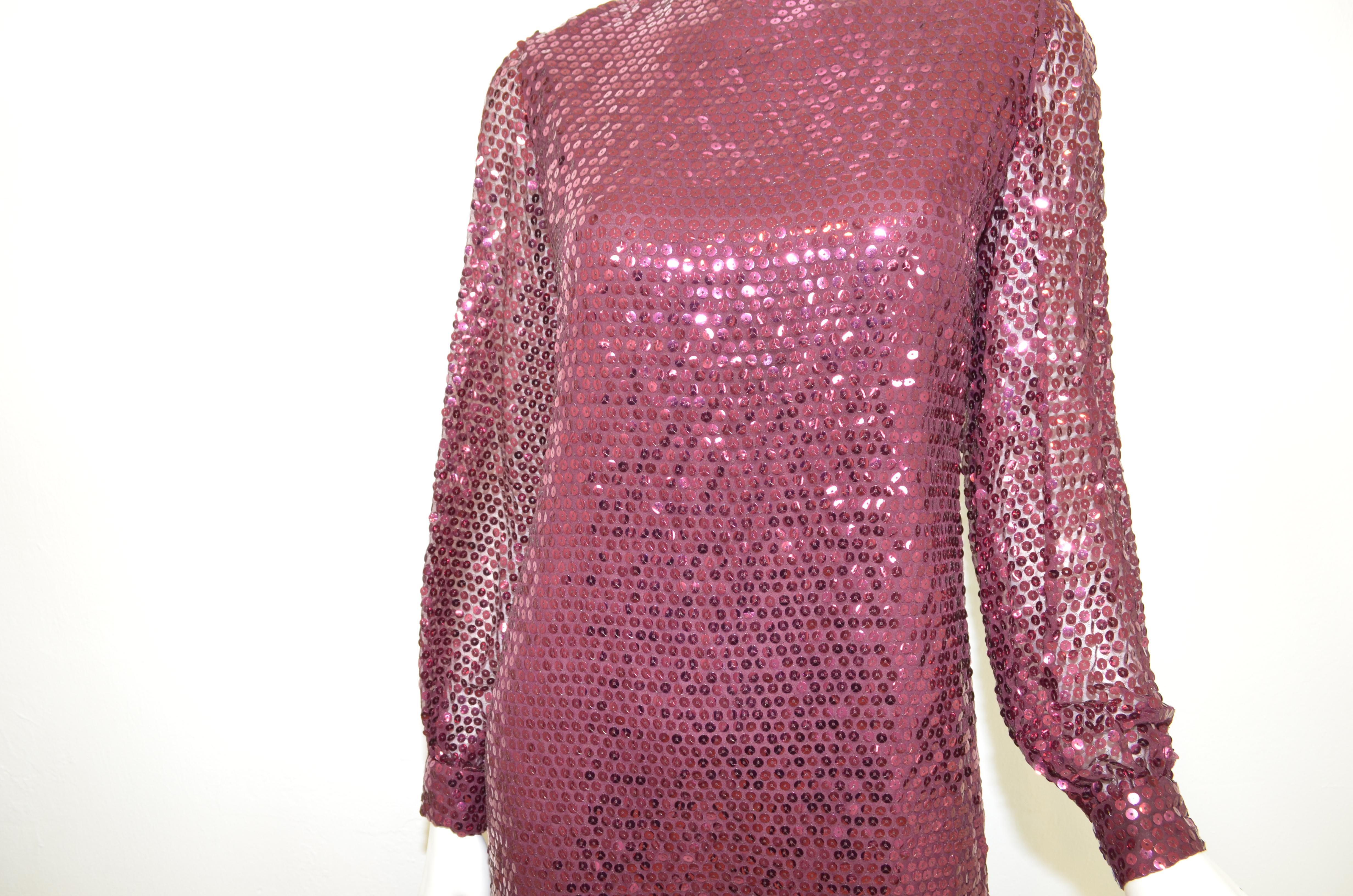 Oscar de la Renta 1970's Sequin Embellished Dress -- Featured in a maroon color embellished with sequins. Dress has a back zipper fastening and a full lining. Dress is in great vintage condition with no major flaws to mention. 

Measurements:
bust