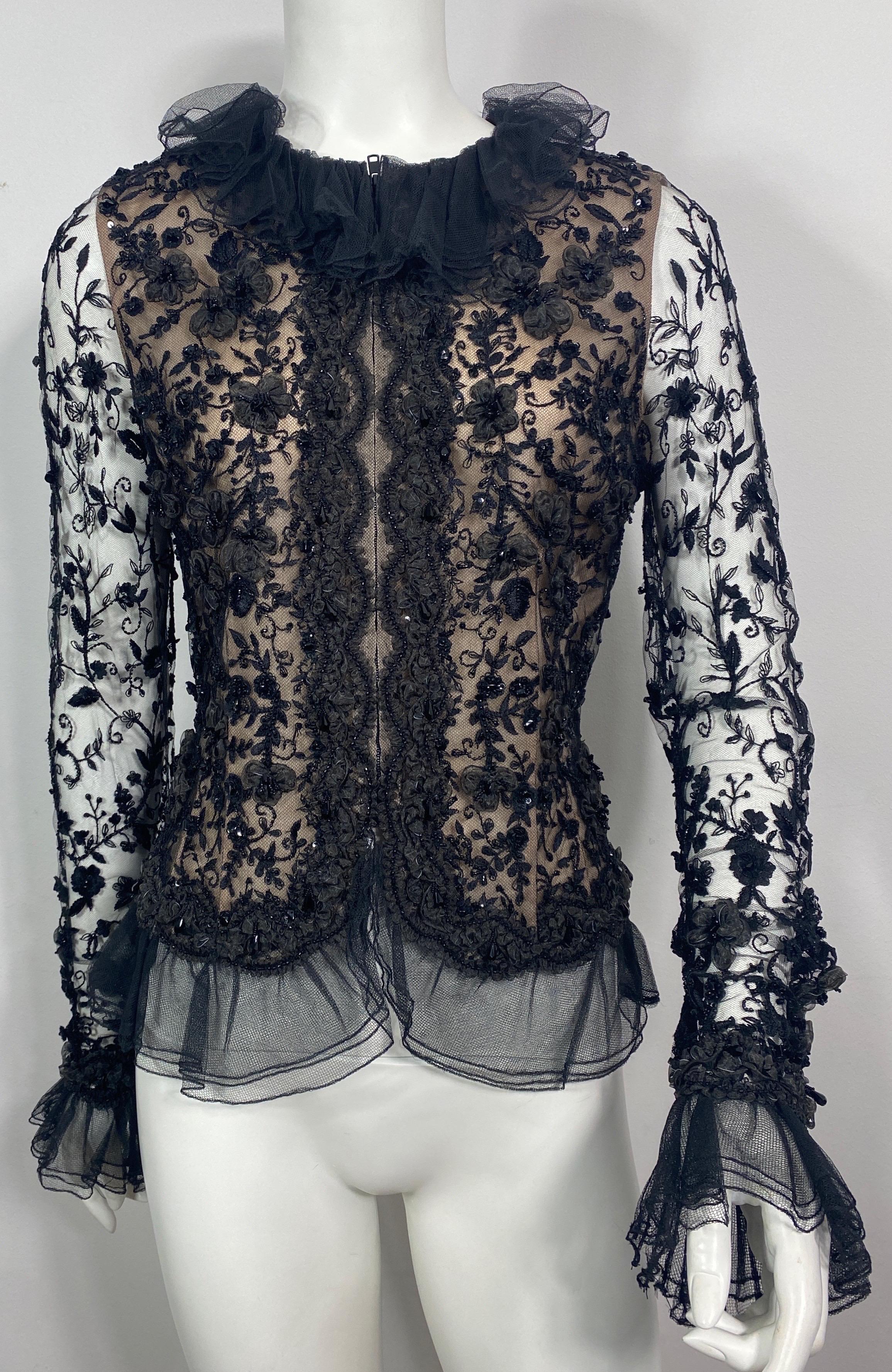 Oscar de La Renta 1980’s Black Lace Embellished Beaded Top Jacket-Size 10 This top can be worn as a jacket, is made of a black lace mesh that is heavily embellished in beads and silk like floral appliques, the bodice of the jacket is lined in a nude