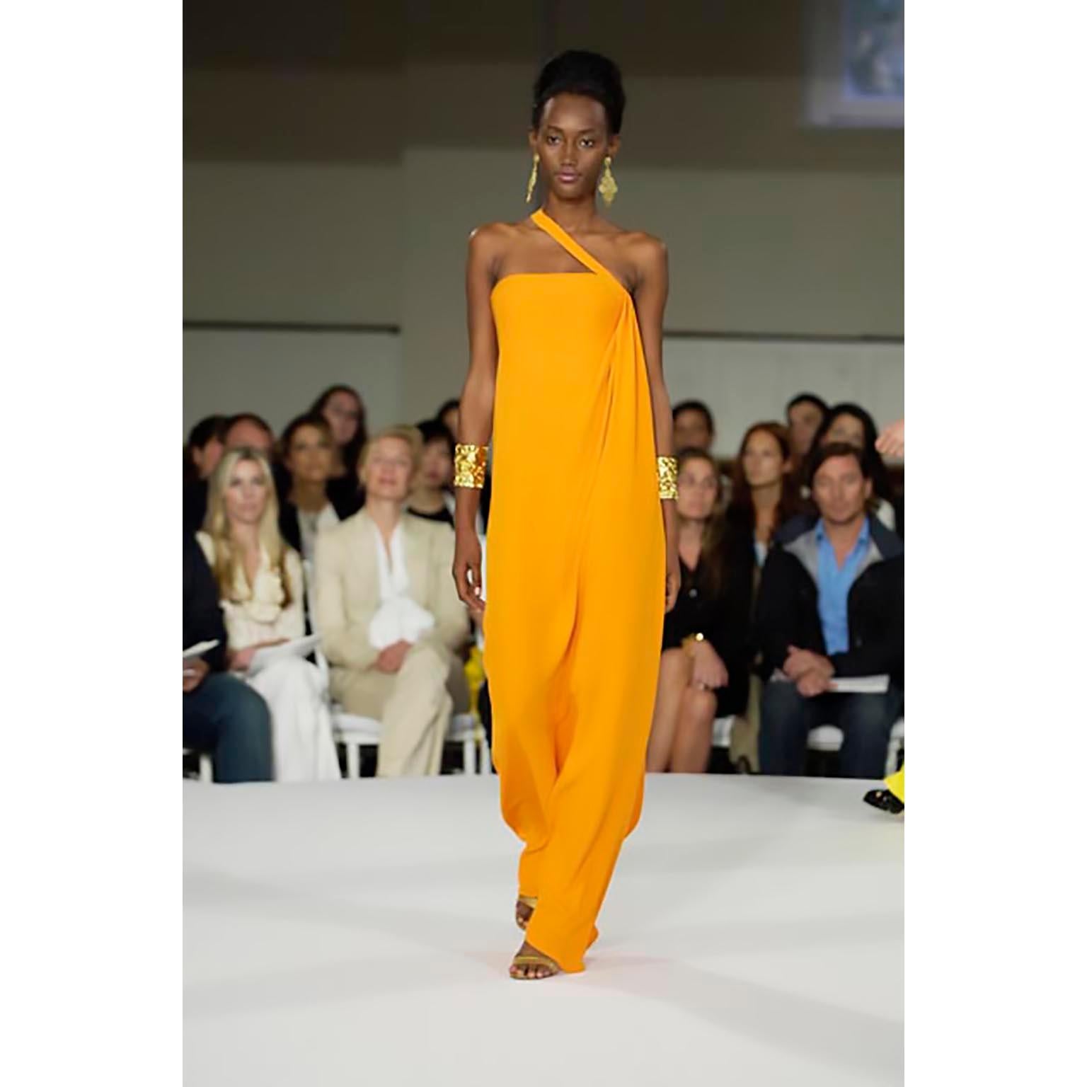 Stunning tangerine orange evening gown by Oscar de la Renta from his 2008 Cruise line. This dress has a fitted 