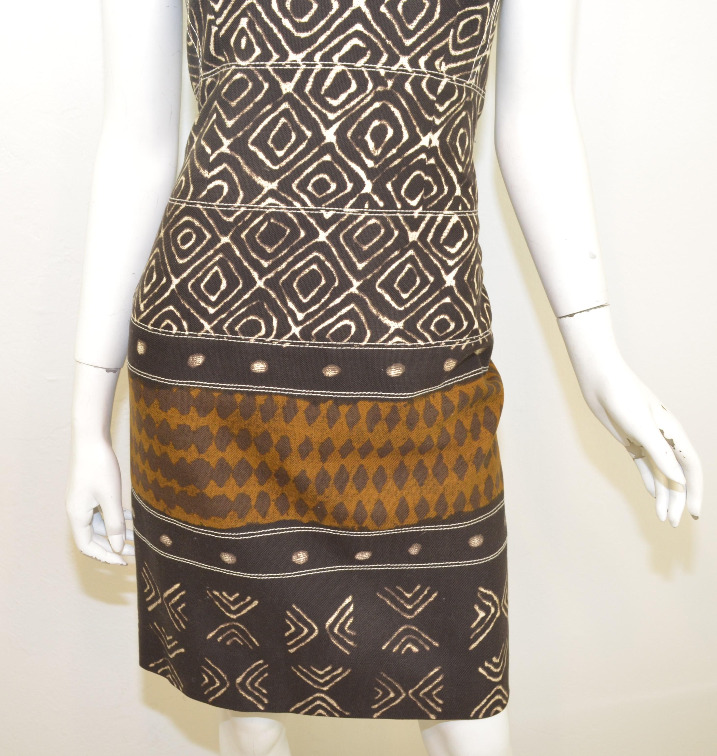 Oscar de la Renta dress from 2008 Summer collection. Dress is featured in a brown tribal print with a uniquely shaped halter neckline, boned bodice, and an open back with snap buttons and a zipper fastening. Dress is a size 6, made in Italy.

Bust