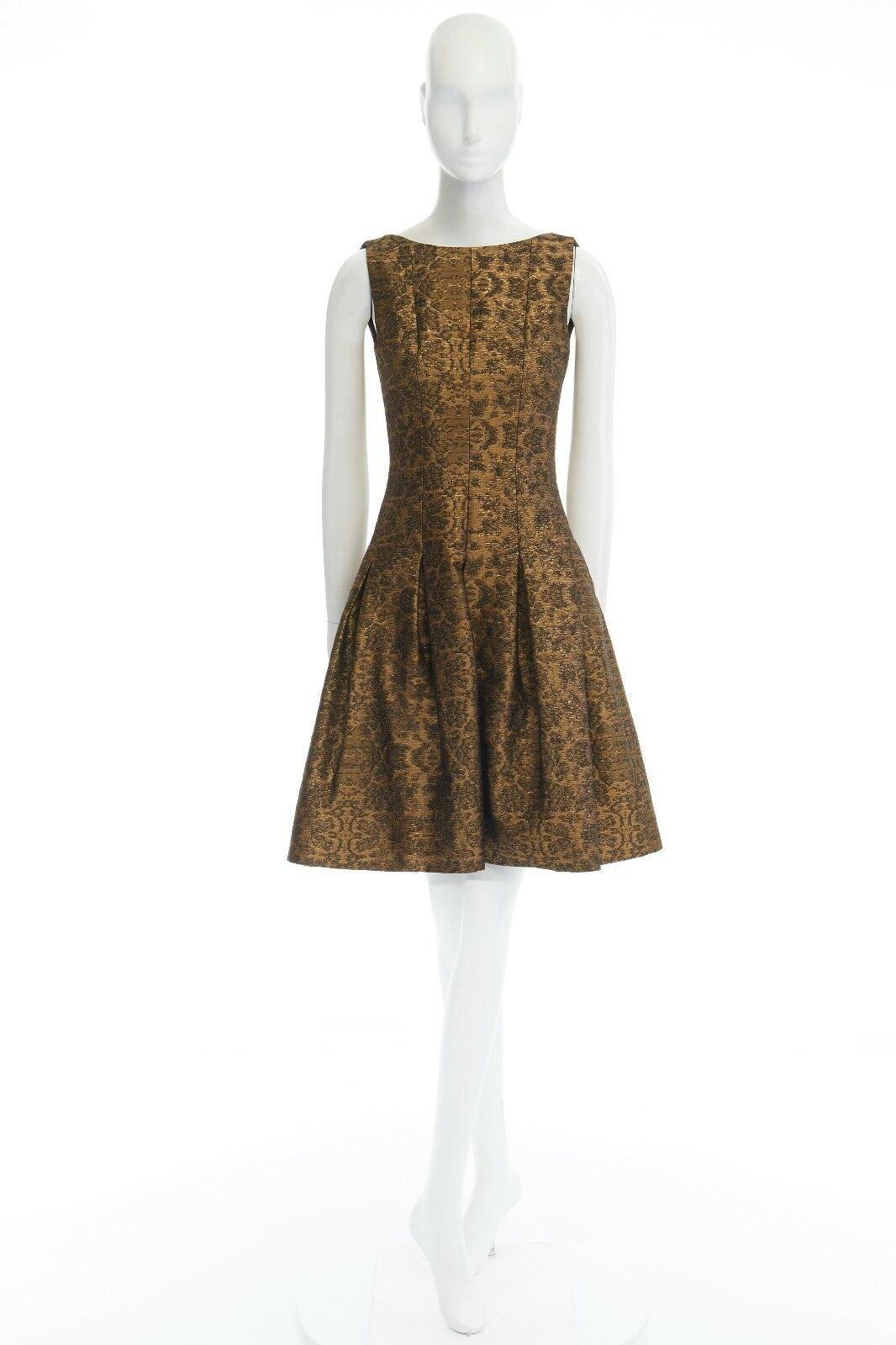 OSCAR DE LA RENTA 2014 gold brocade fit flare skirt cocktail dress US0 XS 
Reference: LNKO/A00683 
Brand: Oscar De La Renta 
Designer: Oscar De La Renta 
Collection: Pre Fall 2014 
Material: Cotton 
Color: Gold 
Closure: Zip 
Extra Detail: FROM THE