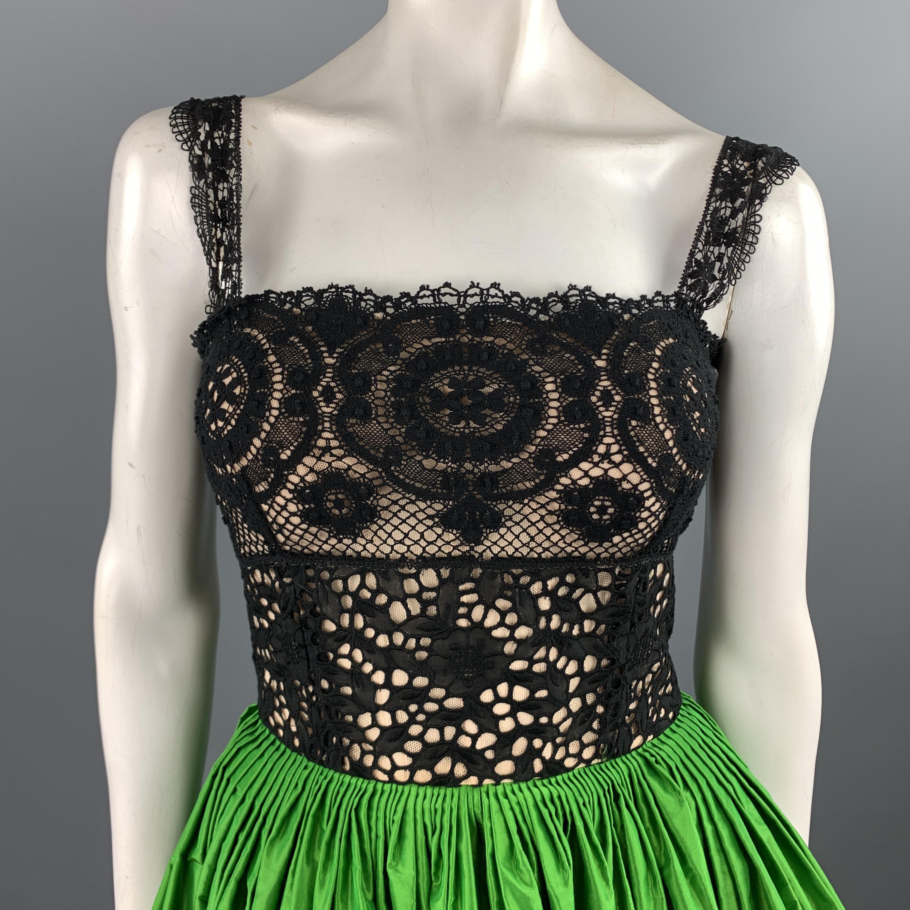 OSCAR DE LA RENTA Spring 2012 Collection evening gown features a black cotton lace bodice with beige silk tulle bustier liner and full green silk taffeta pleated ball skirt with matching sash. Made in USA.

Excellent Pre-Owned Condition.
Marked: US