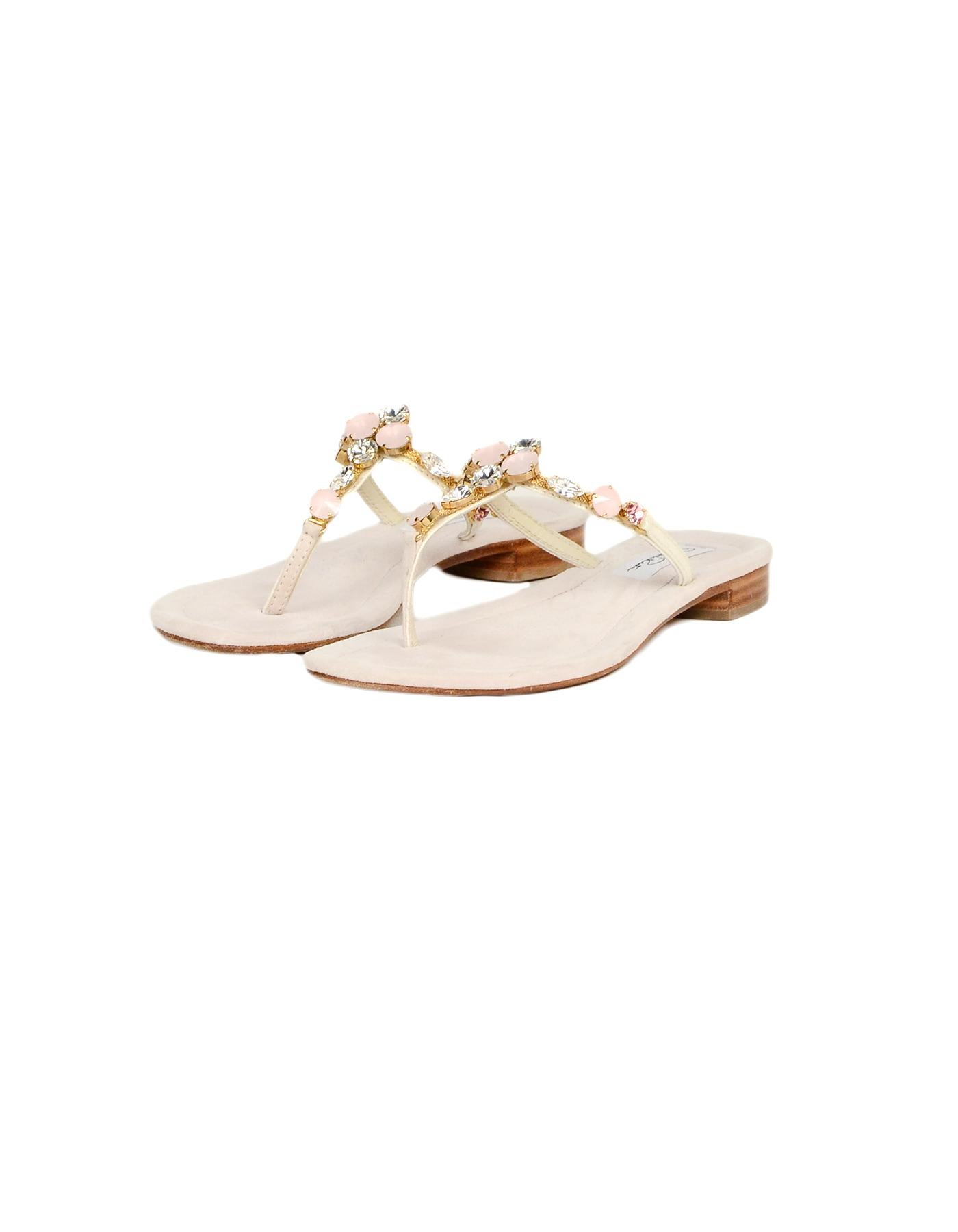 Oscar de la Renta Beige Suede Embellished Thong Sandals Sz 35

Made In: Italy
Color: Beige/blush
Hardware: Goldtone
Materials: Suede, crystals
Closure/Opening: Slide on
Overall Condition: Excellent pre-owned condition with exception of minor marks