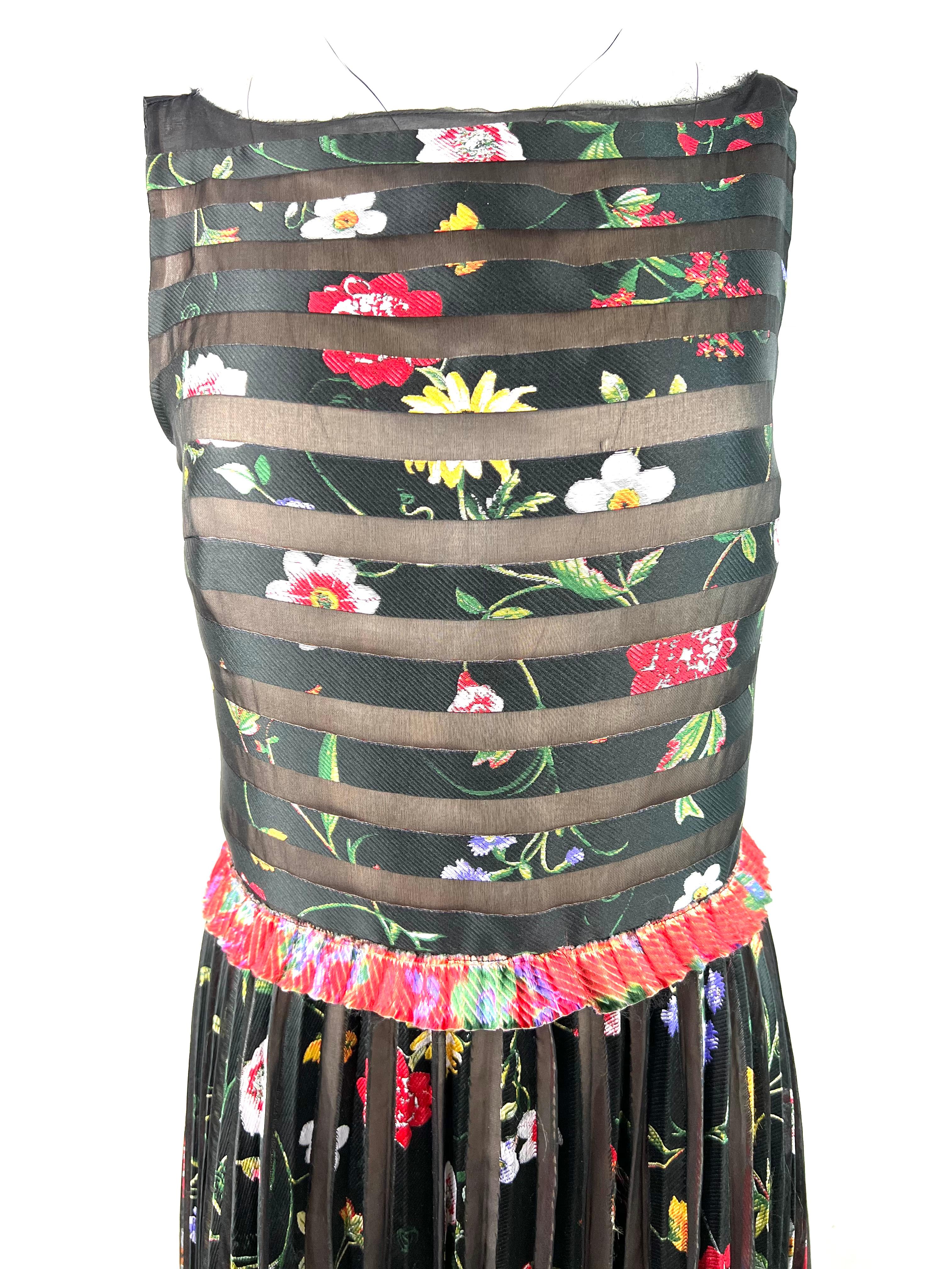 Product details:

The dress features sleeveless style with multicored floral and striped pattern design, floor length.