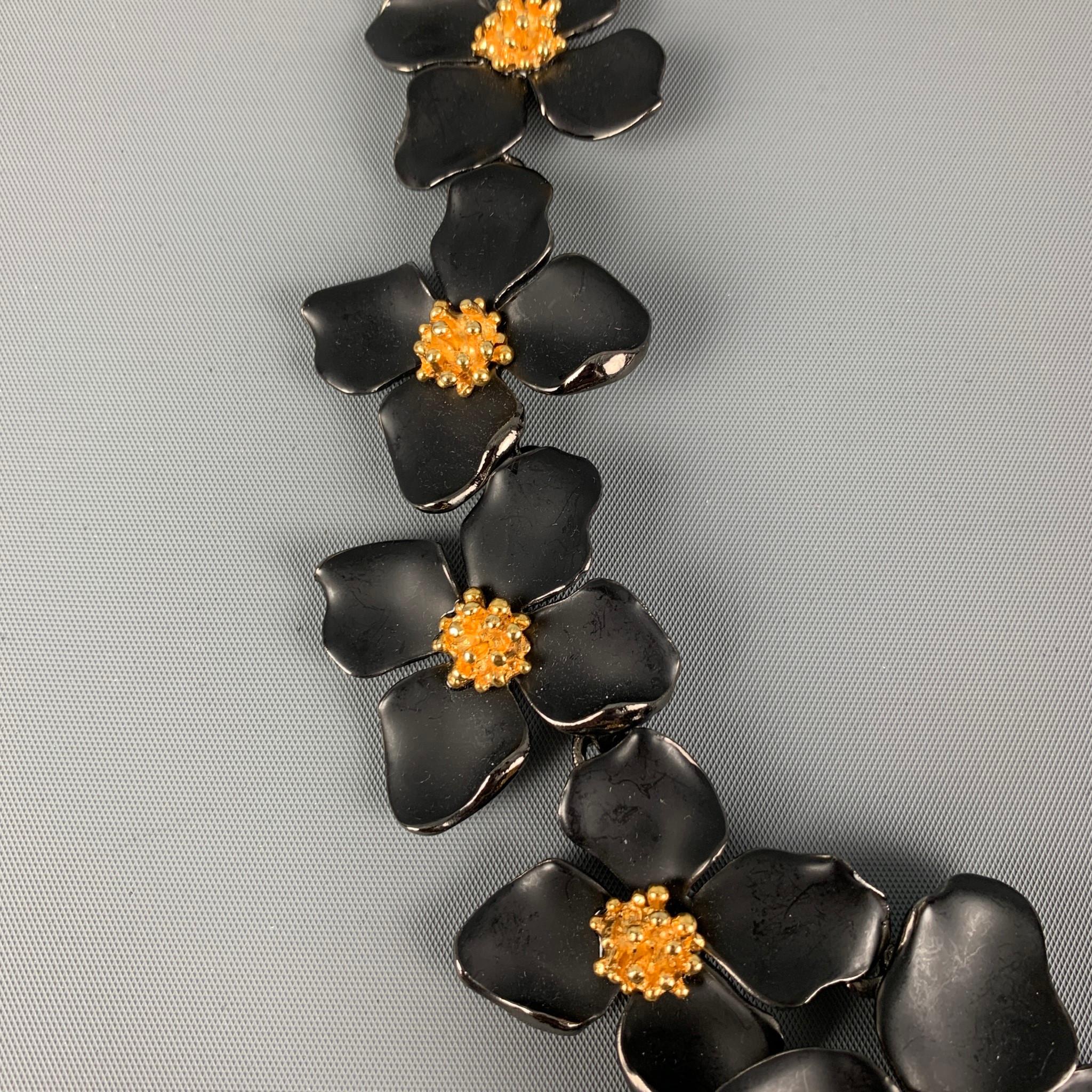 OSCAR DE LA RENTA necklace comes in a black & gold metal featuring a floral design and a clasp closure. Includes dust bag and tags. 

Excellent Pre-Owned Condition.
Original Retail Price: $424.00

Measurements:

Length: 20.5 in. 