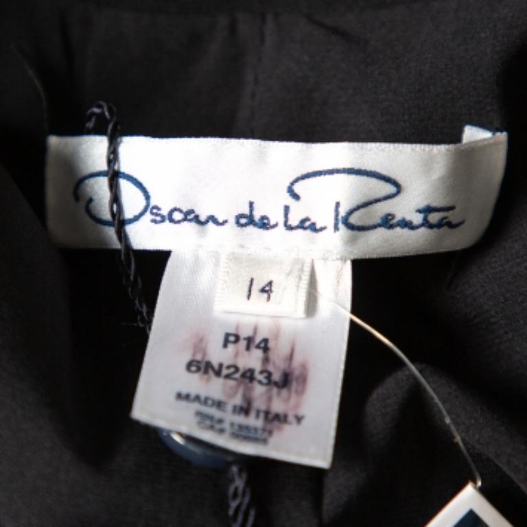 Make a refined statement with help from this Oscar de la Renta women's black blazer. Tailored beautifully, the collarless blazer features draped detailing, long sleeves, and front button fastening.