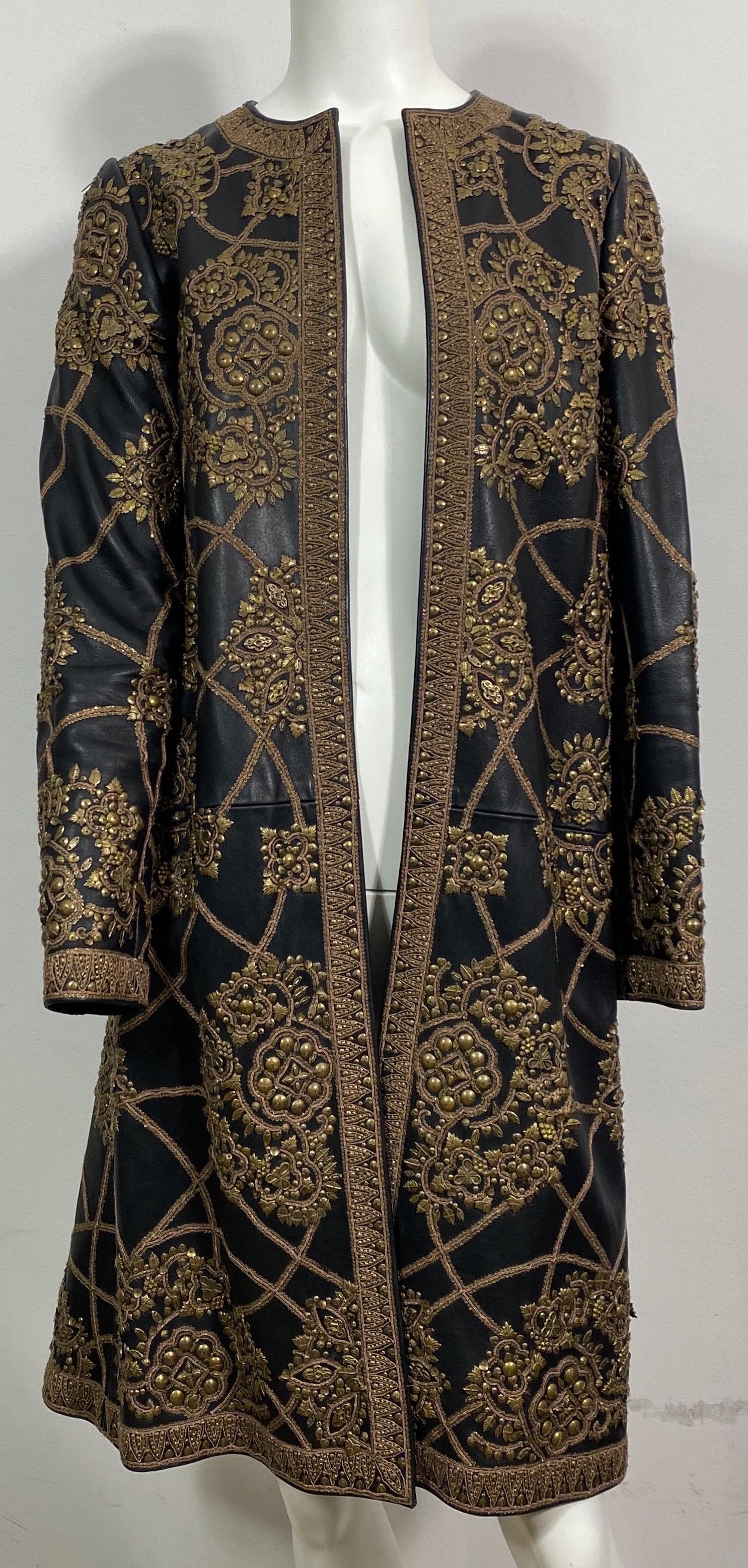 Oscar de la Renta Black Lambskin Leather Embellished Coat-Fall 2006-Size 2 This fully lined coat is made of a black soft lambskin leather and is Heavily embellished with antique copper mini sequence, ornaments of different shapes and copper cording