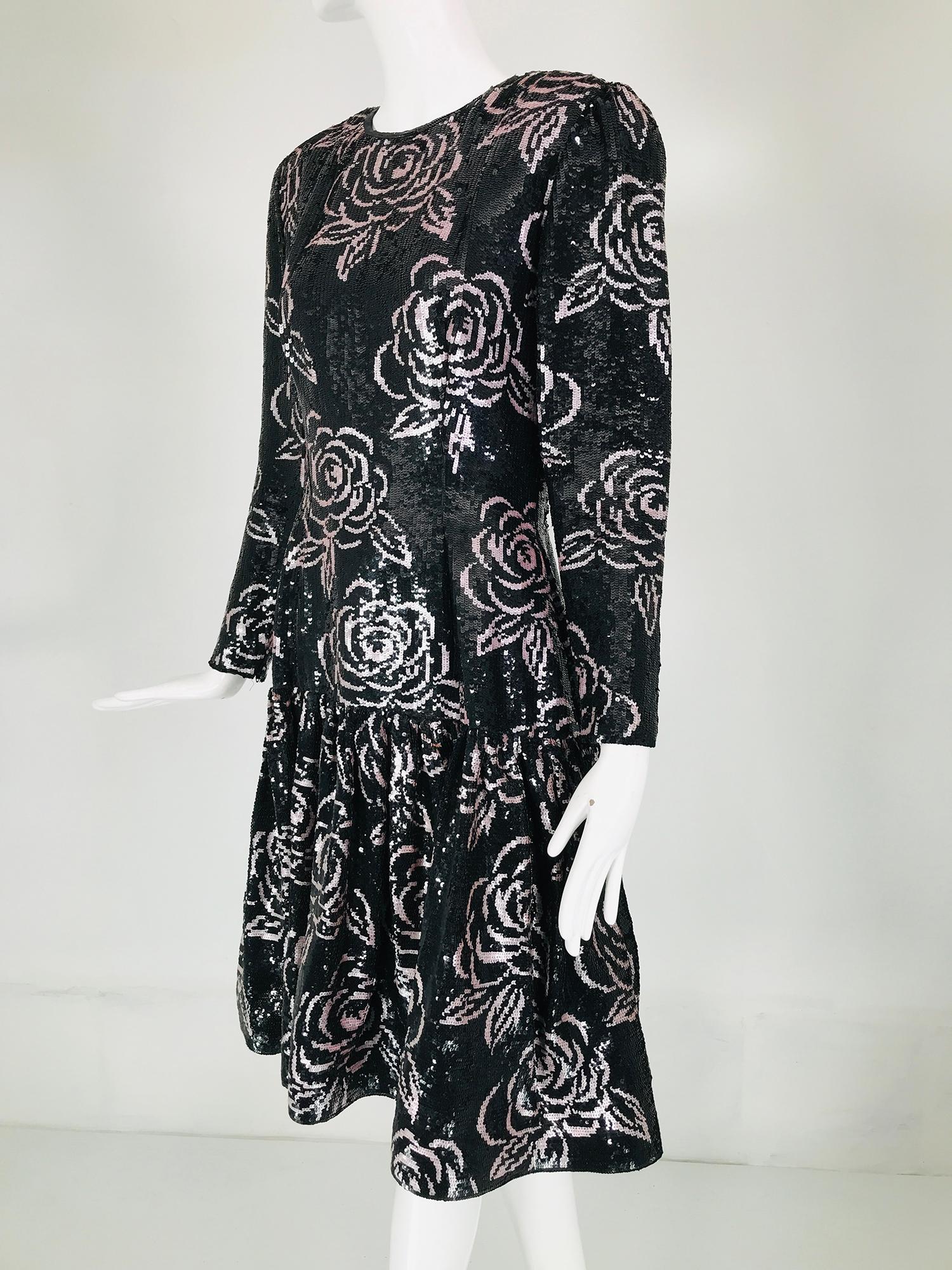 Oscar de la Renta black sequin encrusted dress with pale pink roses done in outlined sequins throughout, from the 1980s Jewel neck evening dress with princess seams, long sleeves that closes at each cuff with a zipper. The dress is fitted through