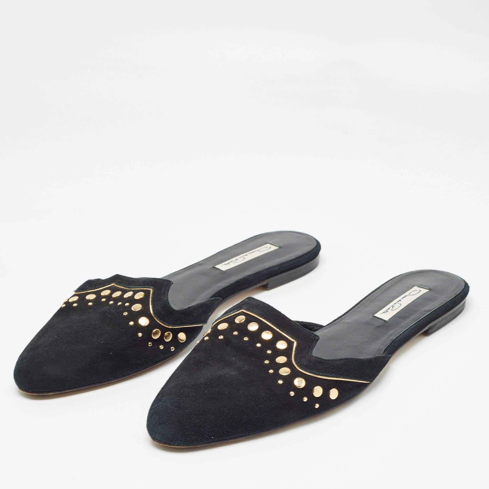 These flat mules from the house of Oscar de la Renta are designed in black suede and punctuated with golden stud details. Skip your heels and switch to these flat mules for a comfortable day