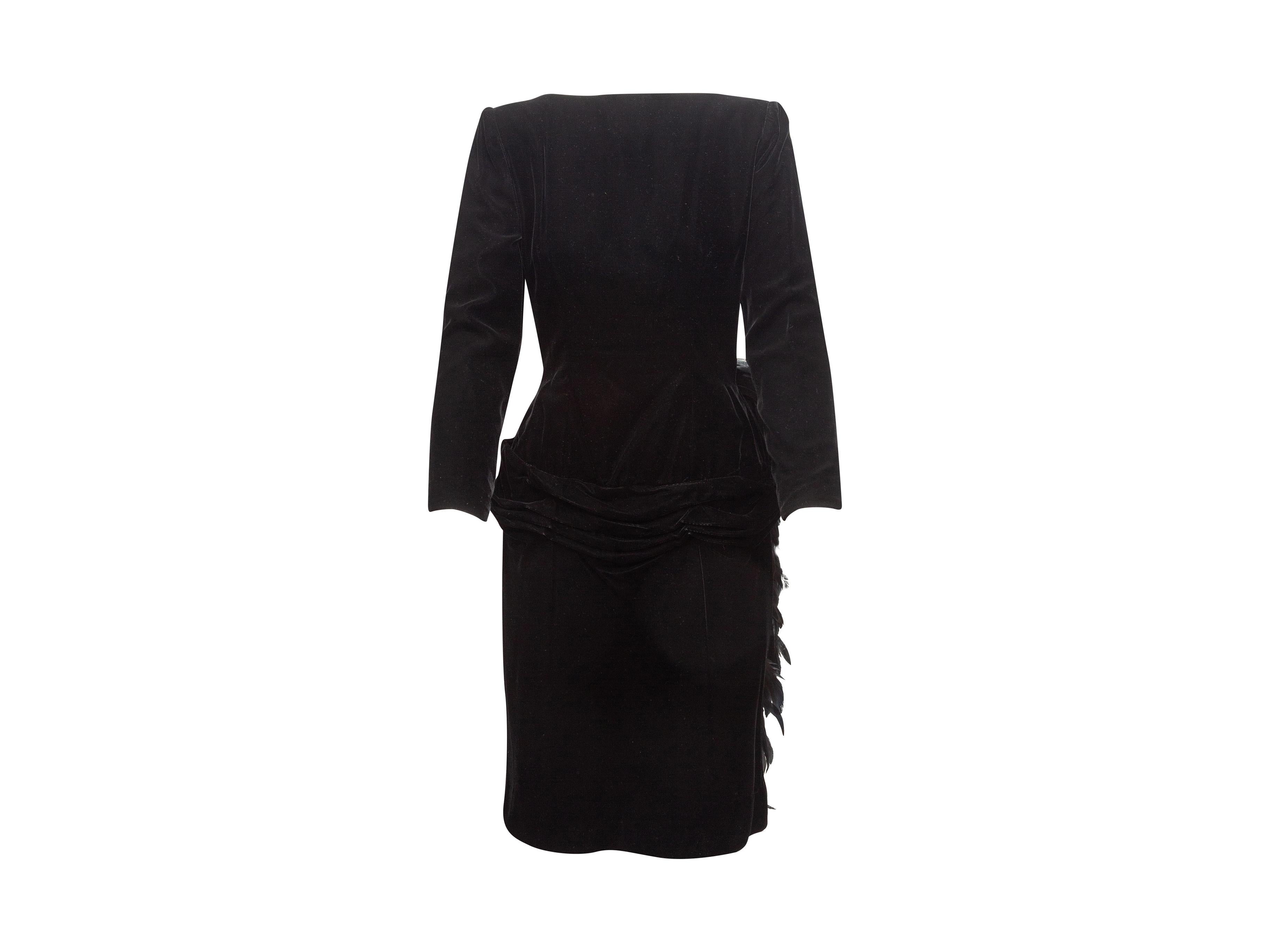 Product details: Vintage black velvet cocktail dress by Oscar de la Renta. Boat neckline. Long sleeves. Feather bustle at back. Open back. 34