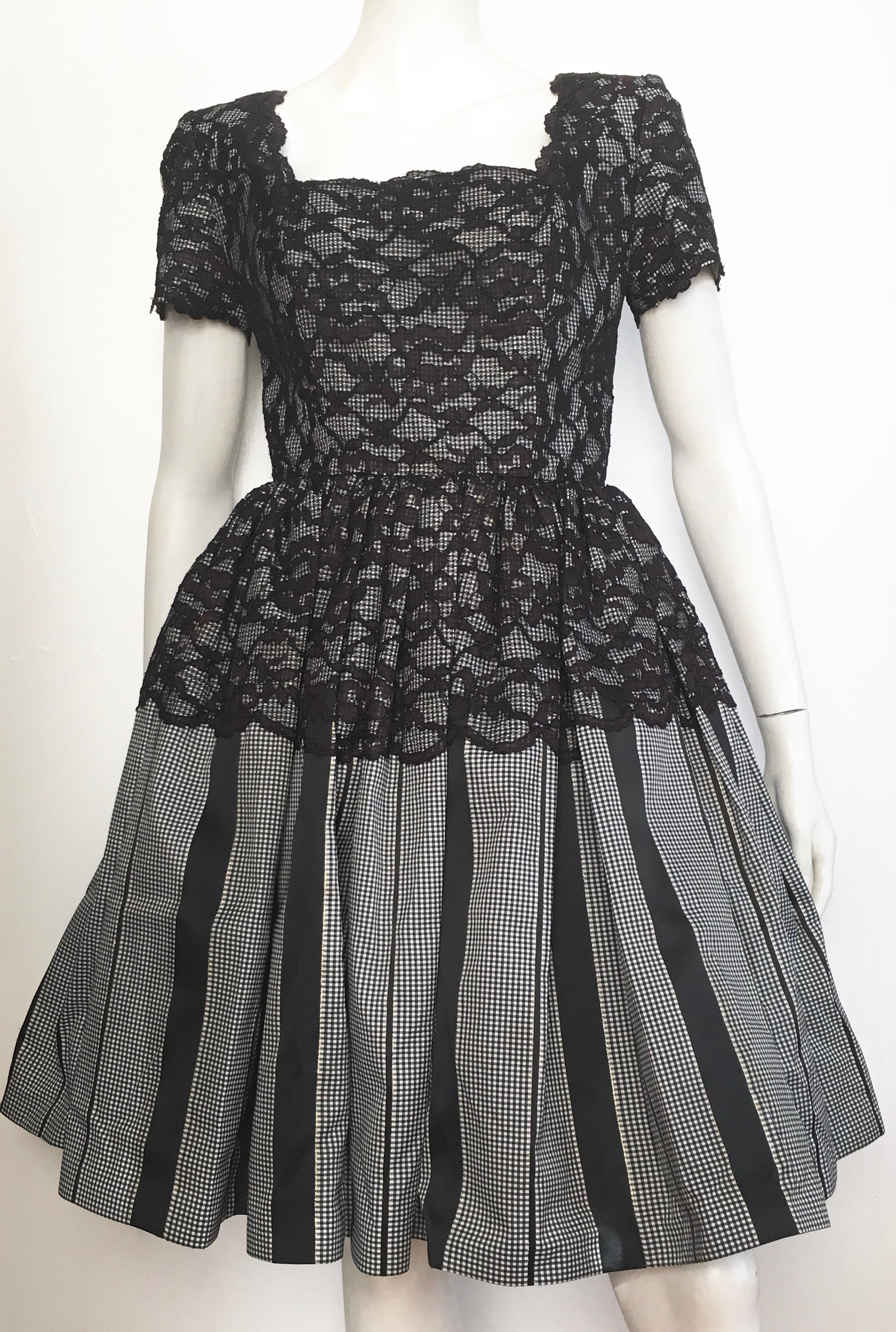 Oscar de la Renta 1980s silk taffeta with black lace evening cocktail dress is a size 6.  The waist on this dress is 28