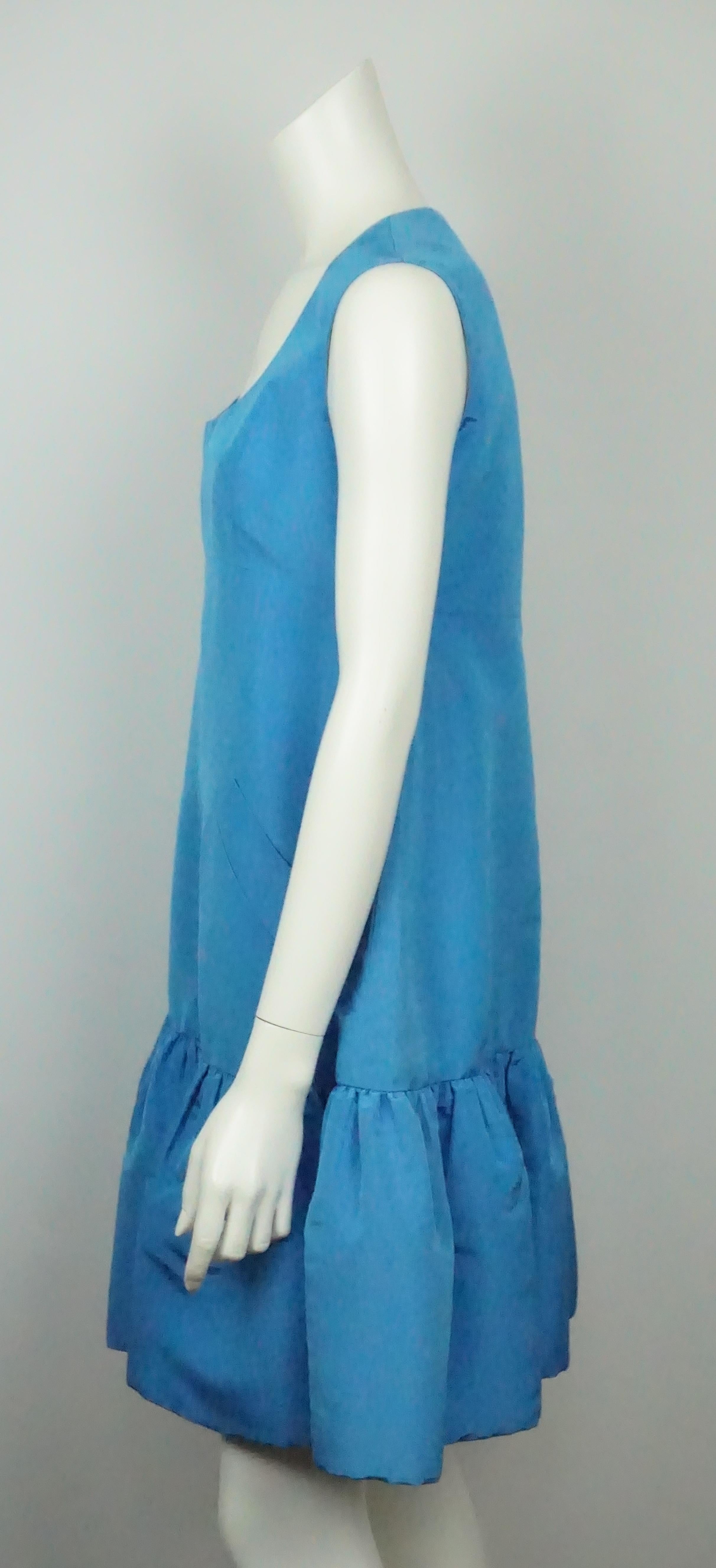 Oscar De La Renta Blue W/ Ruffle Bottom Dress - 8. This beautiful Oscar De La Renta sleeveless dress is in great condition. It has minimal signs of use. The dress is a vibrant blue color and made of taffeta. It is a shift dress type fit, very loose