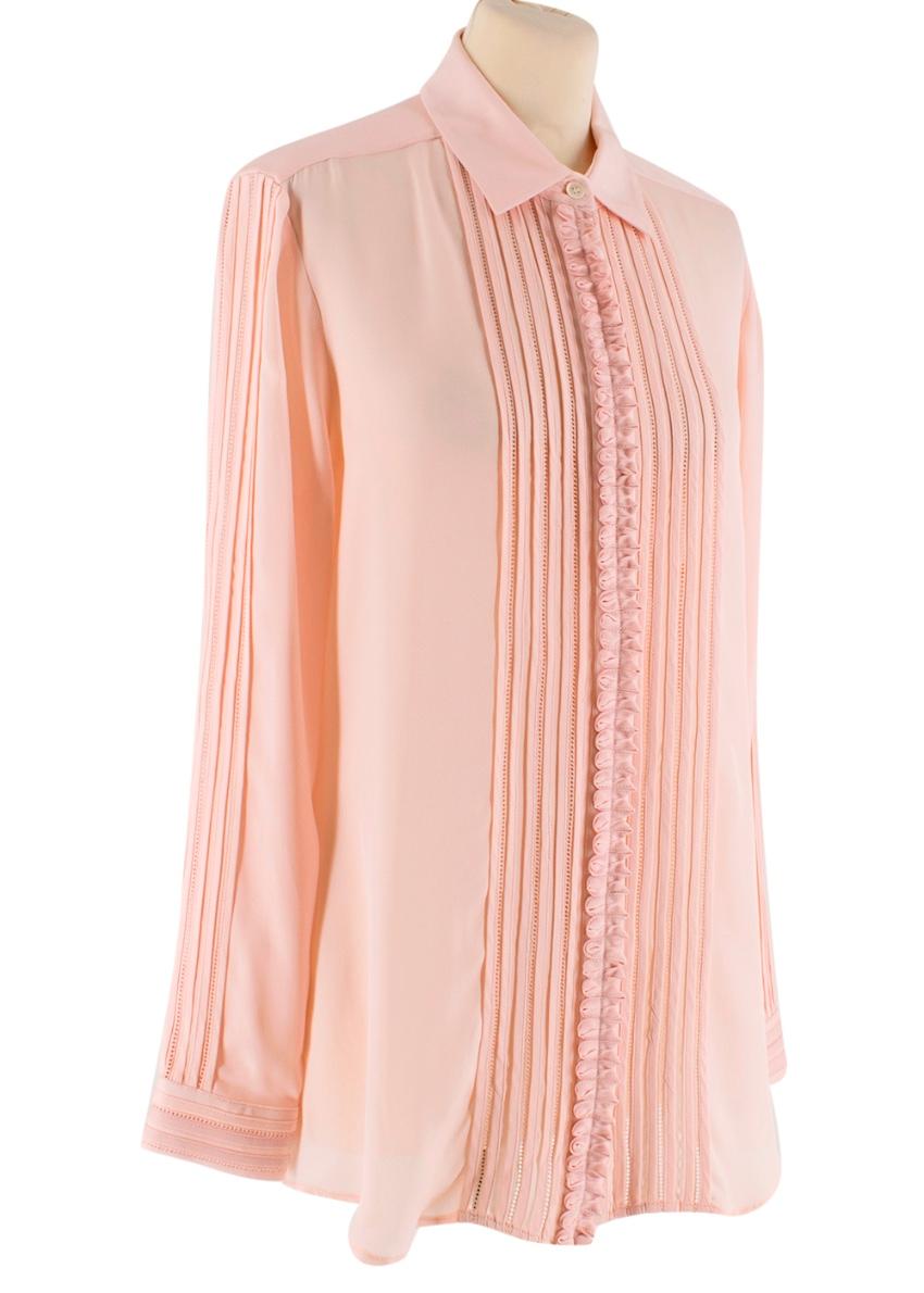 Oscar De La Renta Blush Pink Button-Up Shirt

- Pointed Collar 
- Button-Down Front Closure 
- Frilled Trim to Closure 
- Rounded Hemline
- Perforated Trim to Sleeves and Closure 

Materials 
100% Silk 

Dry Clean Only 

Made in India 
Measurements