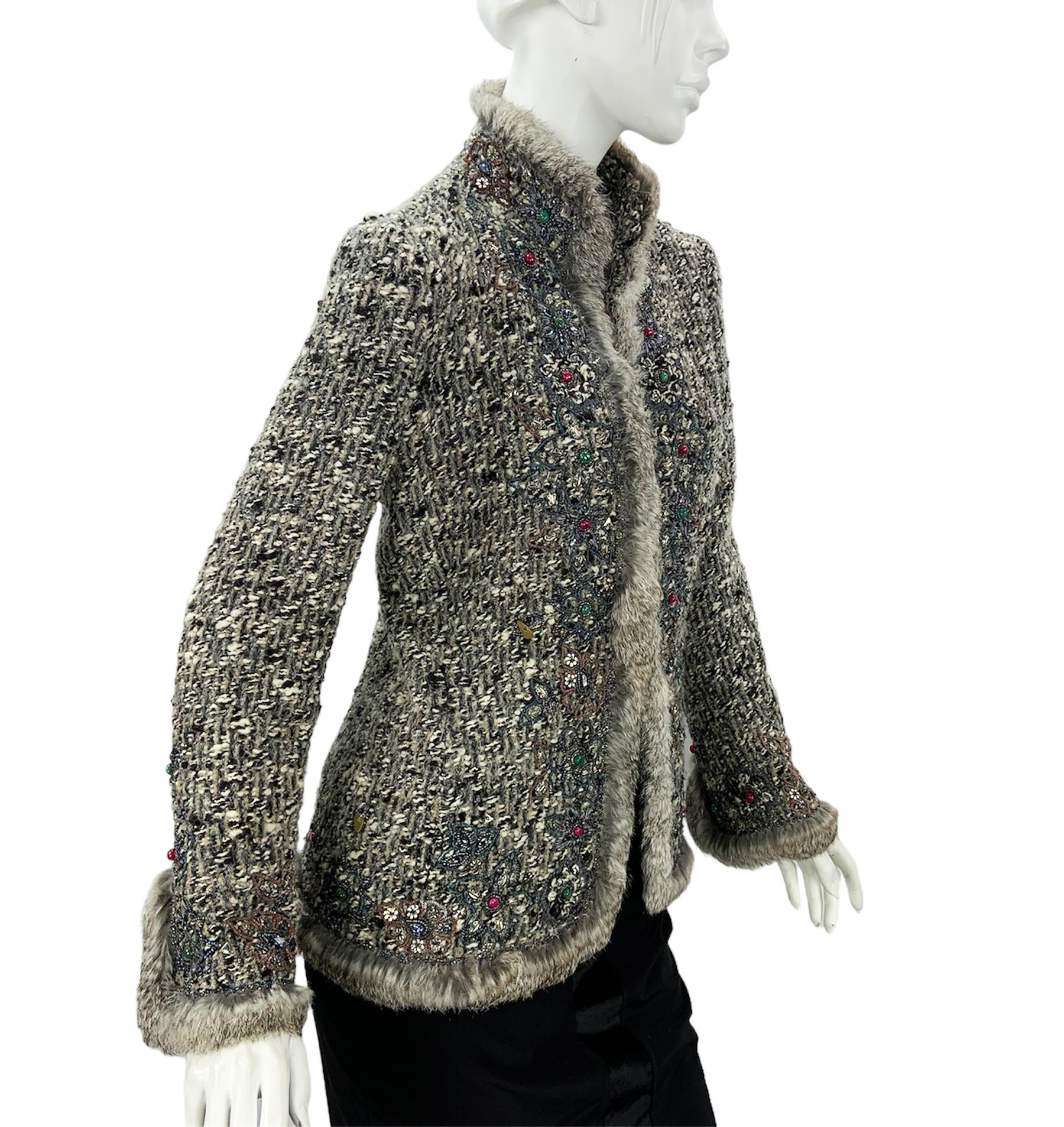 Rare, Museum Quality Oscar de la Renta Boucle Jacket Cardigan
Designer size 10
F/W 2004 Collection
Rich Embellished and Embroidered, Rabbit Fur Trim, Hook and Eye Closure, Partly Lined.
85% Wool, 10% Mohair, 5% Polyamide.
Measurements: Length - 26