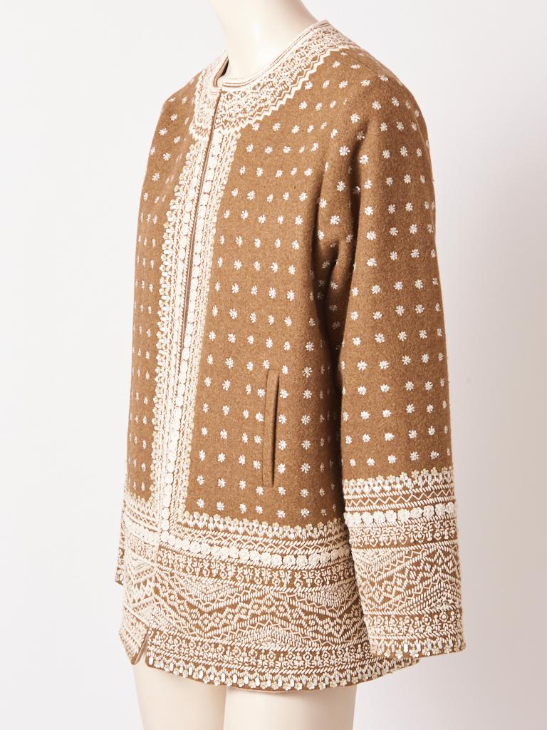 Oscar de la Renta, camel tone, cashmere, cardigan/jacket,  embellished with subtle, iridescent sequins and hand stitched embroidery in a folkloric inspired motif. Jacket has two slit pockets. 