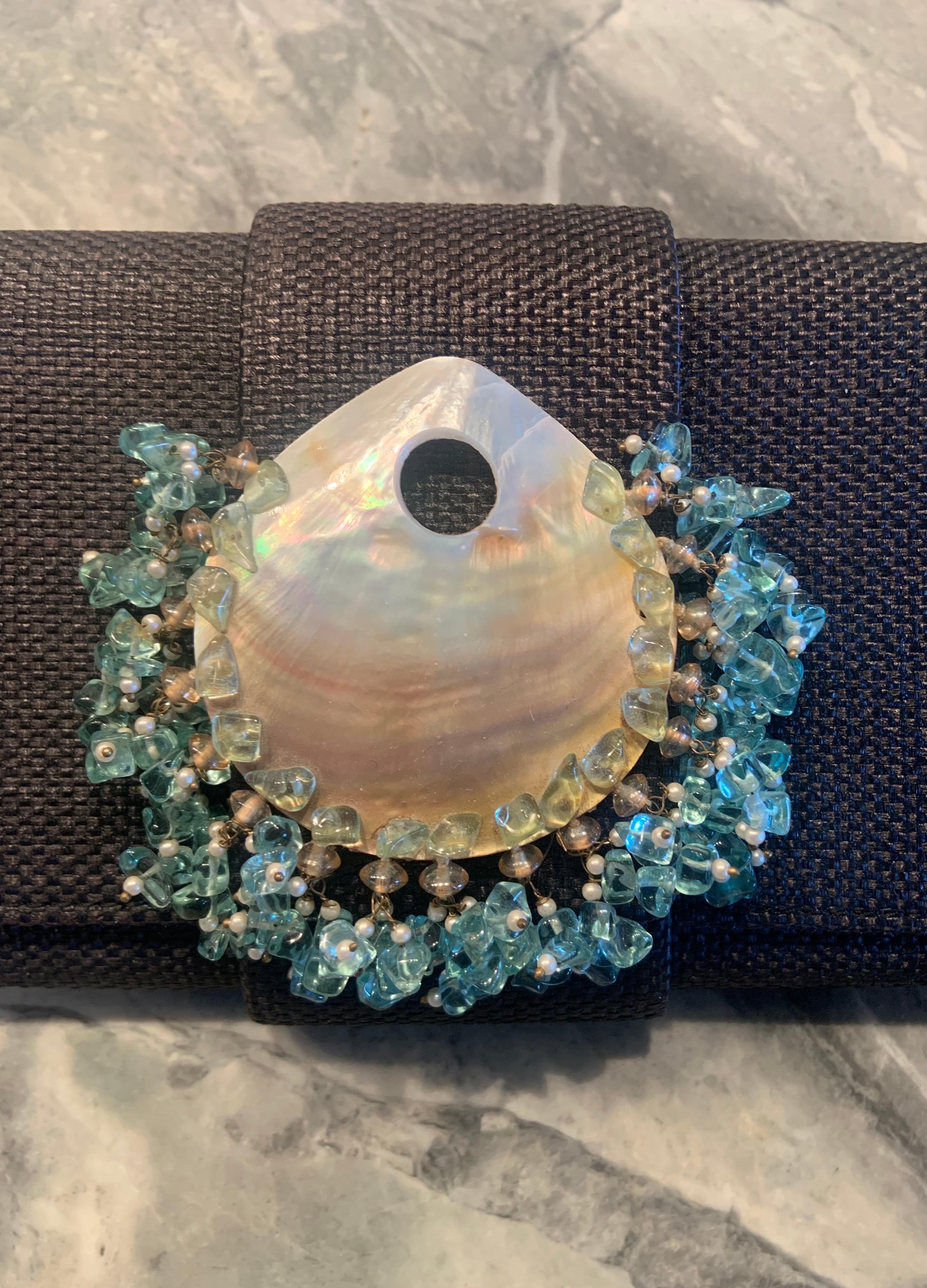 This charming clutch bag from Oscar de la Renta puts a whole new spin on the words 