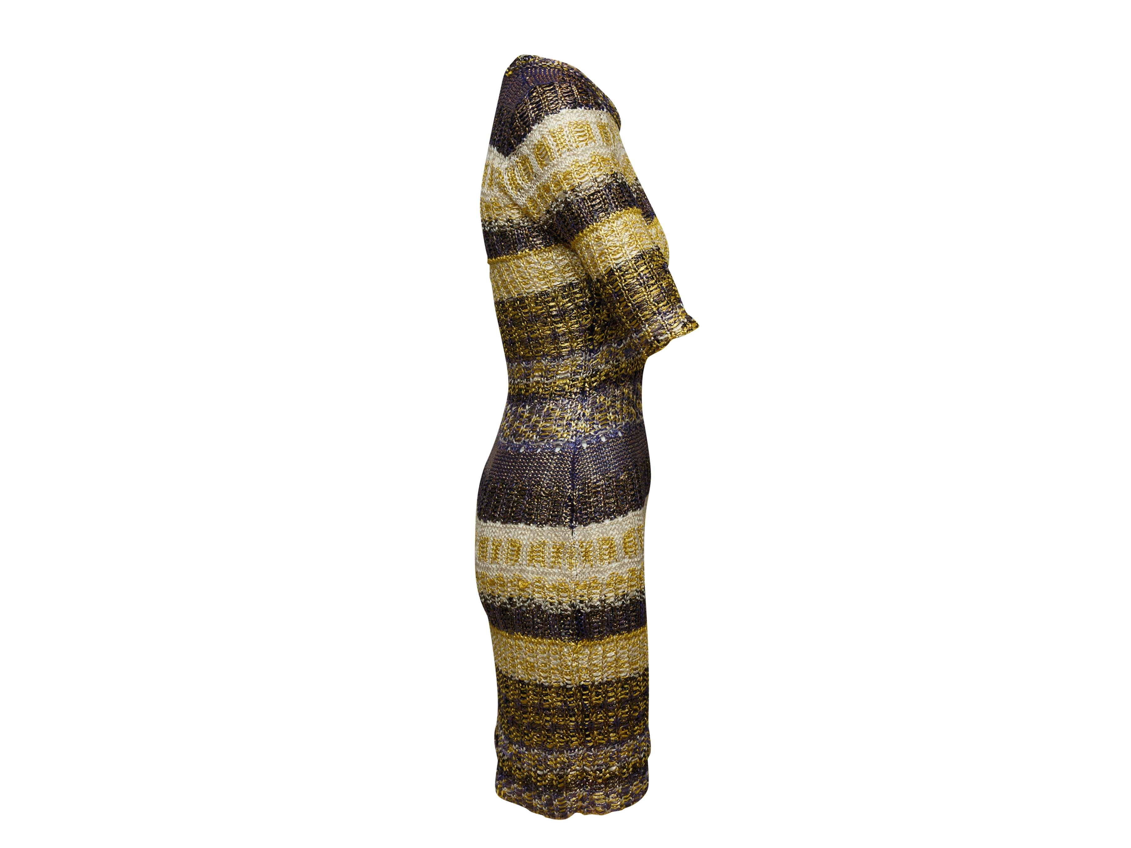 Product details: Dark brown and multicolor knit dress by Oscar de la Renta. From the Fall 2009 Collection. Striped pattern throughout. Crew neck. Three-quarter sleeves. 29