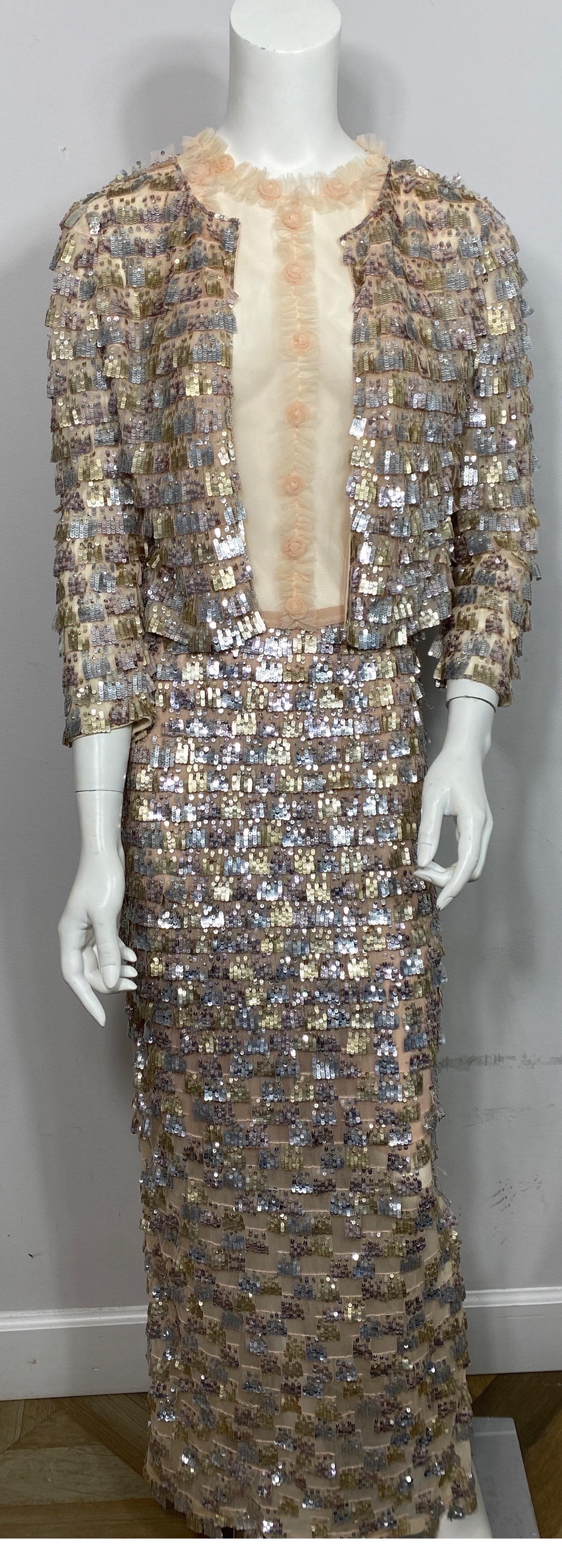 Oscar de la Renta Early 2000’s Nude and Metallic Gown with Jacket-Size 4  This gorgeous Oscar de la Renta 2 piece gown is a classic Oscar creation. The sleeveless bodice of the gown is a transparent nude colored mesh that has a ruffle and mini rose