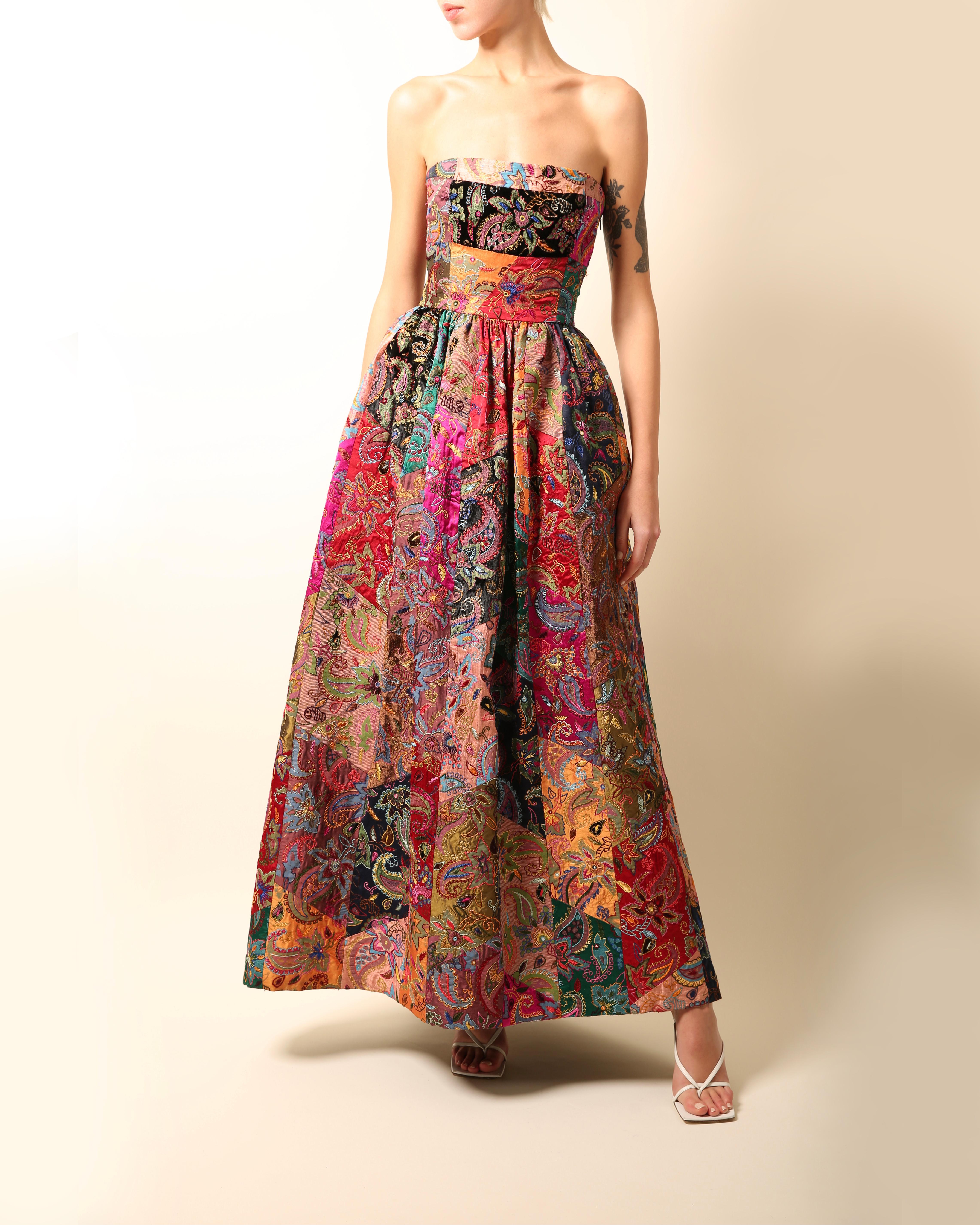 Oscar de la Renta Fall 2002
A beautiful strapless style gown with a fitted waist and flared puff skirt
A patchwork of embroidered silk tapestries in a multitude of colours and floral print
Inner boned bodice that does up via zip and hook
Separate