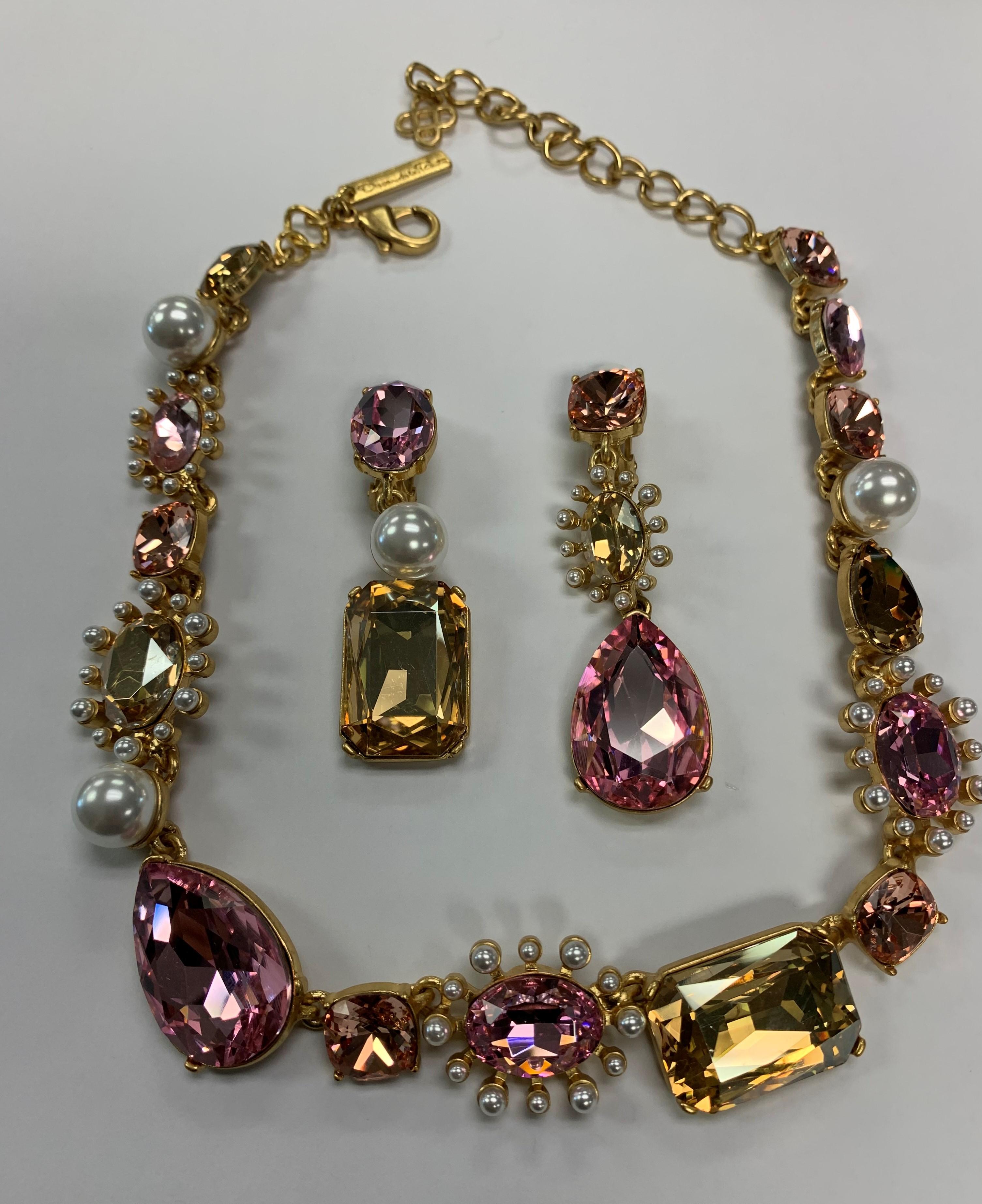 Stunning signed Oscar de la Renta Faux Pearl and Pink Crystal Necklace and matching Earrings with the Designer Signature; necklace measures approx. Approx. 20