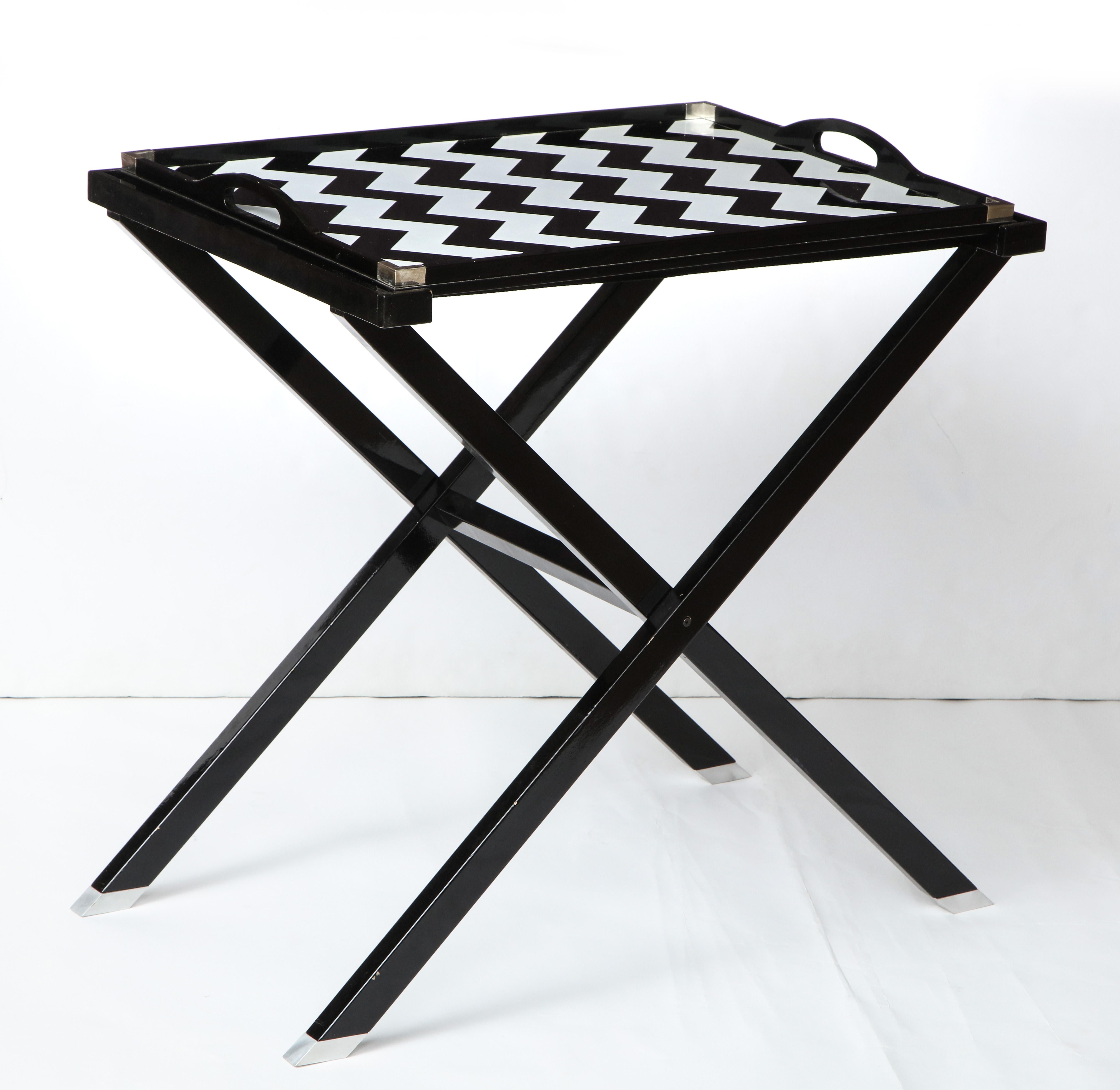 A great designer folding tray table for serving or an occasional table. The black and silver/grey zig zag  design is  by Oscar De la Renta.