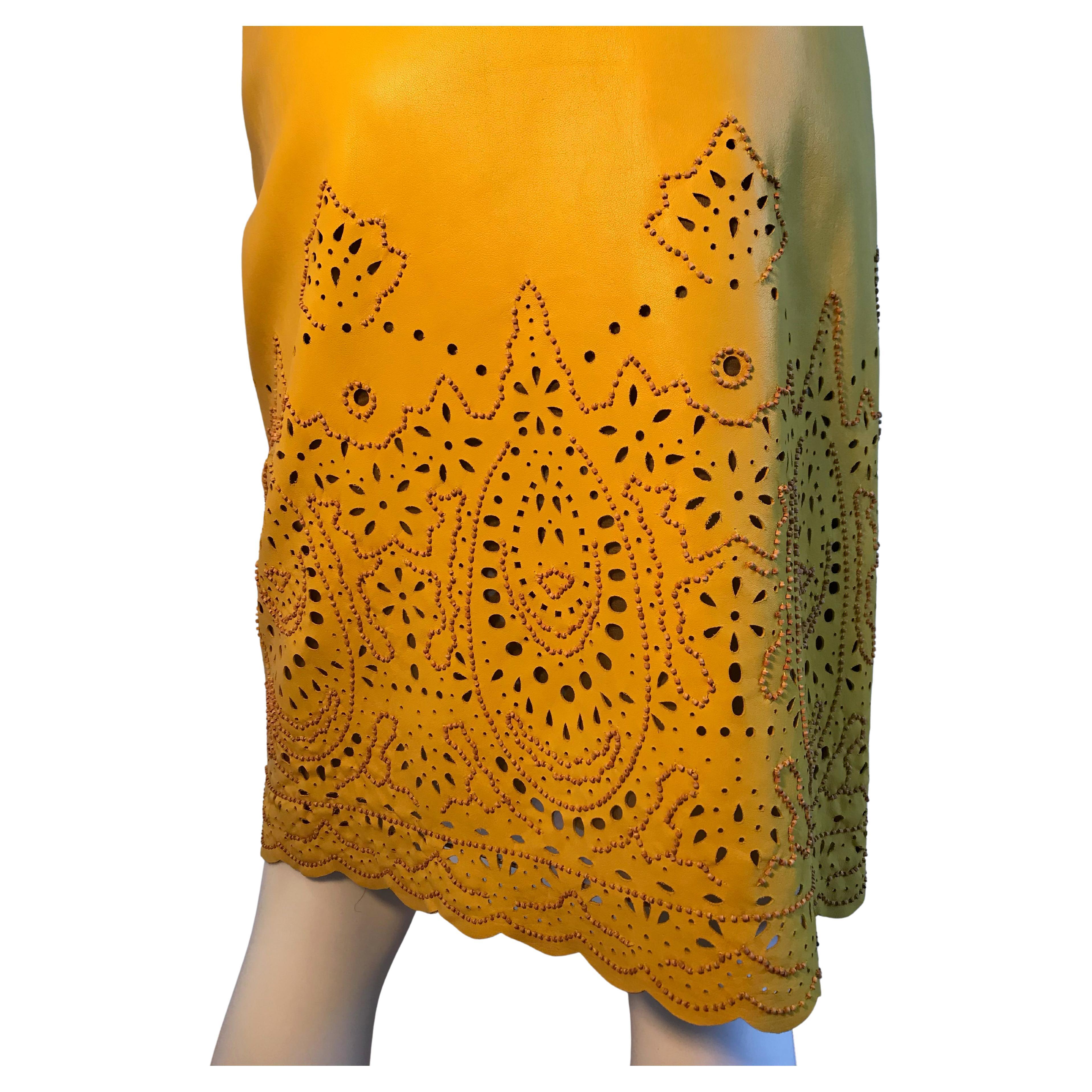 Oscar De La Renta for Saks Fifth Avenue Yellow Leather Cutout Beaded Skirt
Made in USA

Please be mindful that this piece has led a previous life, and may tell its story through minor imperfection. Purchasing this item continues its narrative, so