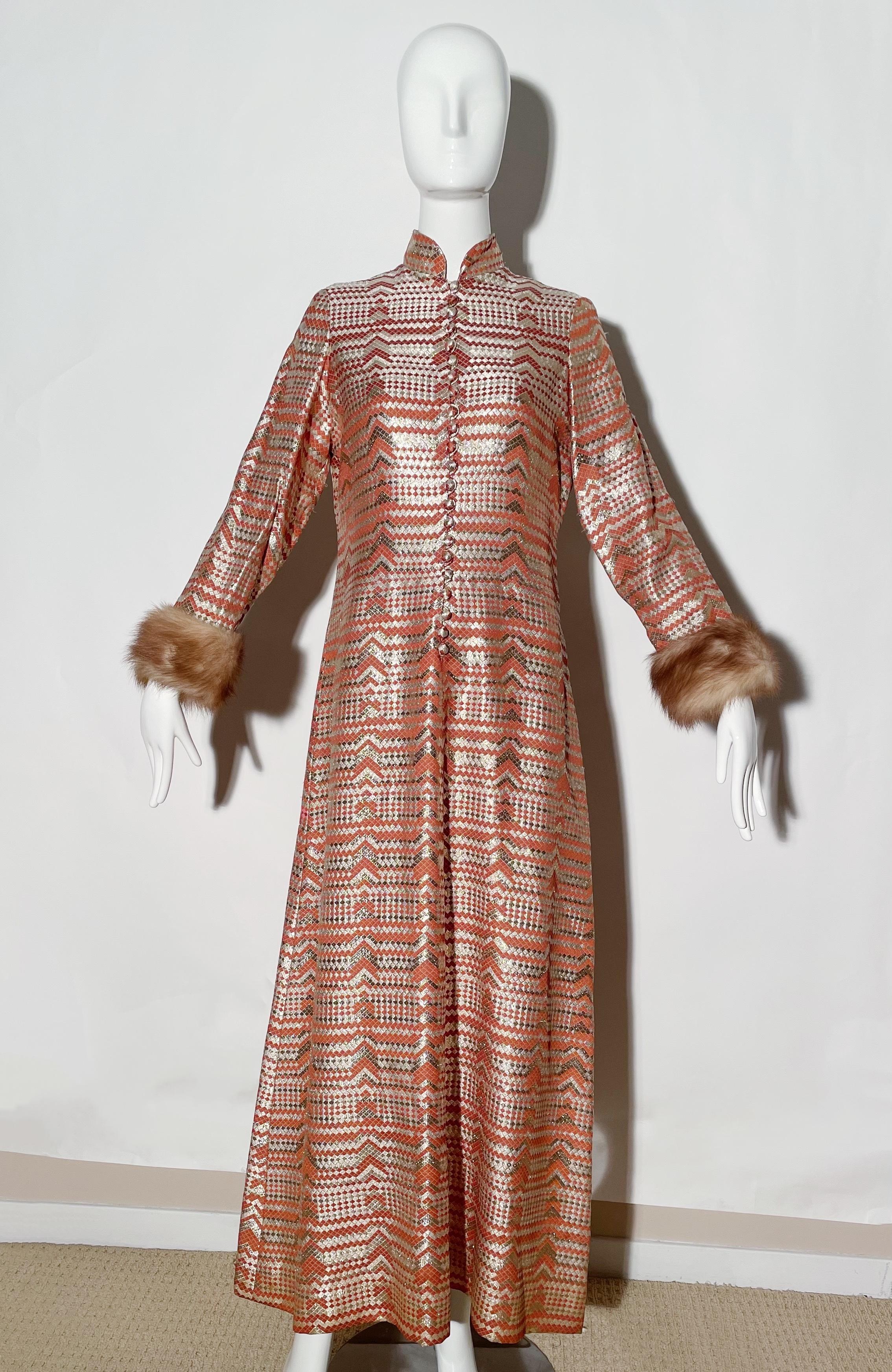 Burnt orange and metallic gown. Fur trim sleeves. Mandarin collar. Front buttons. Rear zipper closure. Lined. 
*Condition: excellent vintage condition. No visible flaws.

Measurements Taken Laying Flat (inches)—
Shoulder to Shoulder: 15 in.
Bust: 38