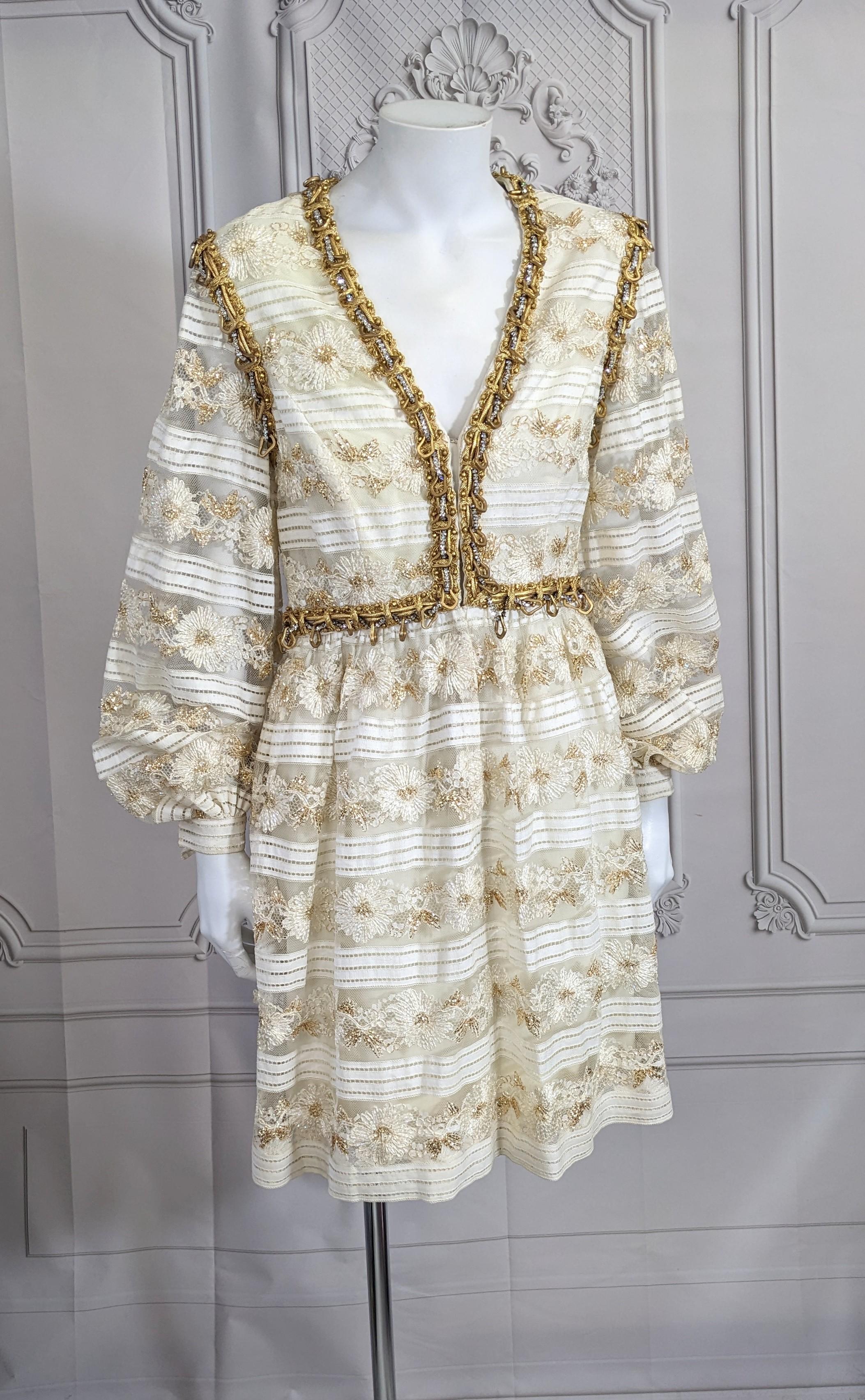Oscar de la Renta Gilt Floral Reembroidered Lace Mini Baby Doll Dress from the 1960's. Designed as a mini with full sheer sleeves with a faux bolero edged in elaborate gold bullion and rhinestone trim with gilt hoops. Opens down front with hooks and