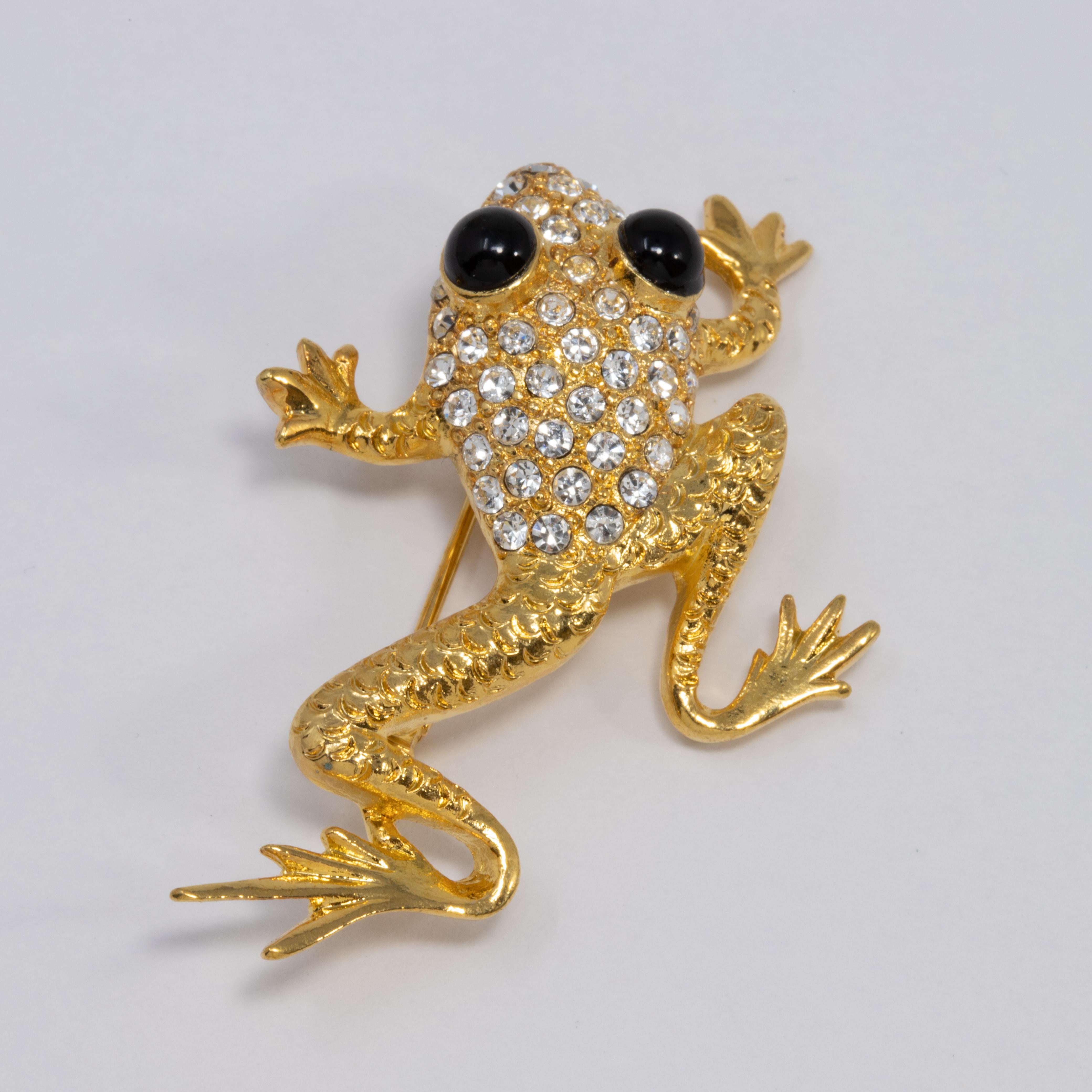 A quirky pin/brooch by Oscar de la Renta! This little gold-tone frog is decorated with pave clear crystals and two striking black cabochon eyes.

Hallmarks: Oscar de la Renta, Made in USA