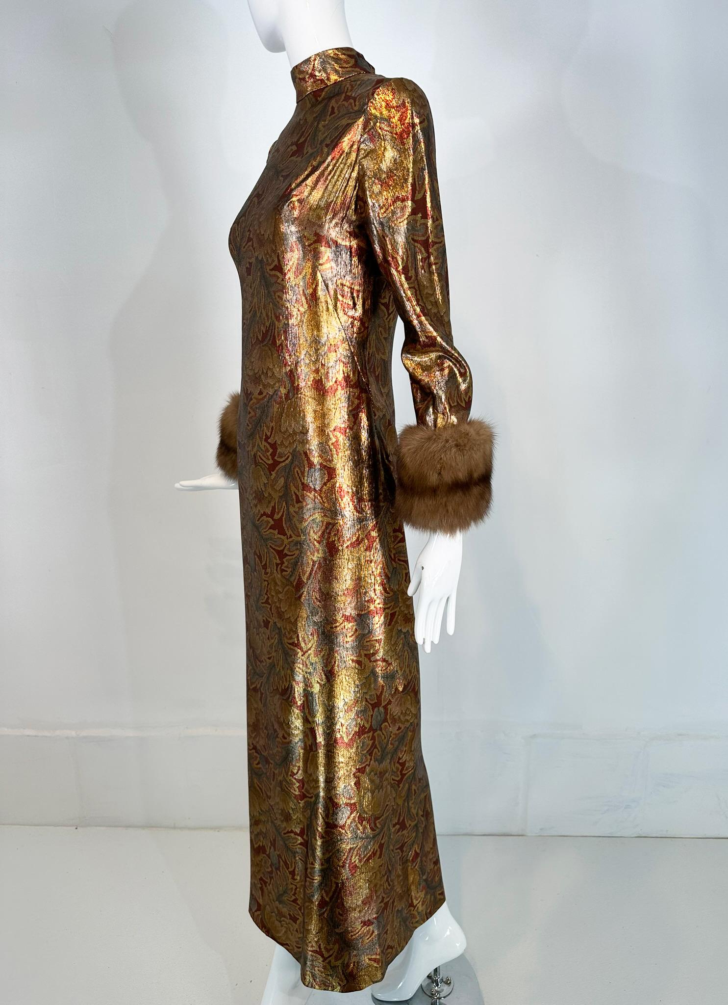 Oscar de la Renta gold silk lame evening gown,  button back with sable fur cuffs, from the 1990s. 
This gorgeous gown shimmers in muted gold, russet & silver, the design is woven in a rich leafy autumnal pattern. The dress features a band collar,