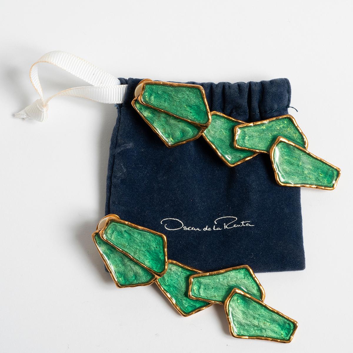 Our vintage clip on earrings by Oscar de la Renta , stamped made in USA, feature gold metal and enamel. A very stylish set of earrings, the deep measures 84.5mm and 26mm at widest point. Included is a Oscar de la Renta pouch, and we date production