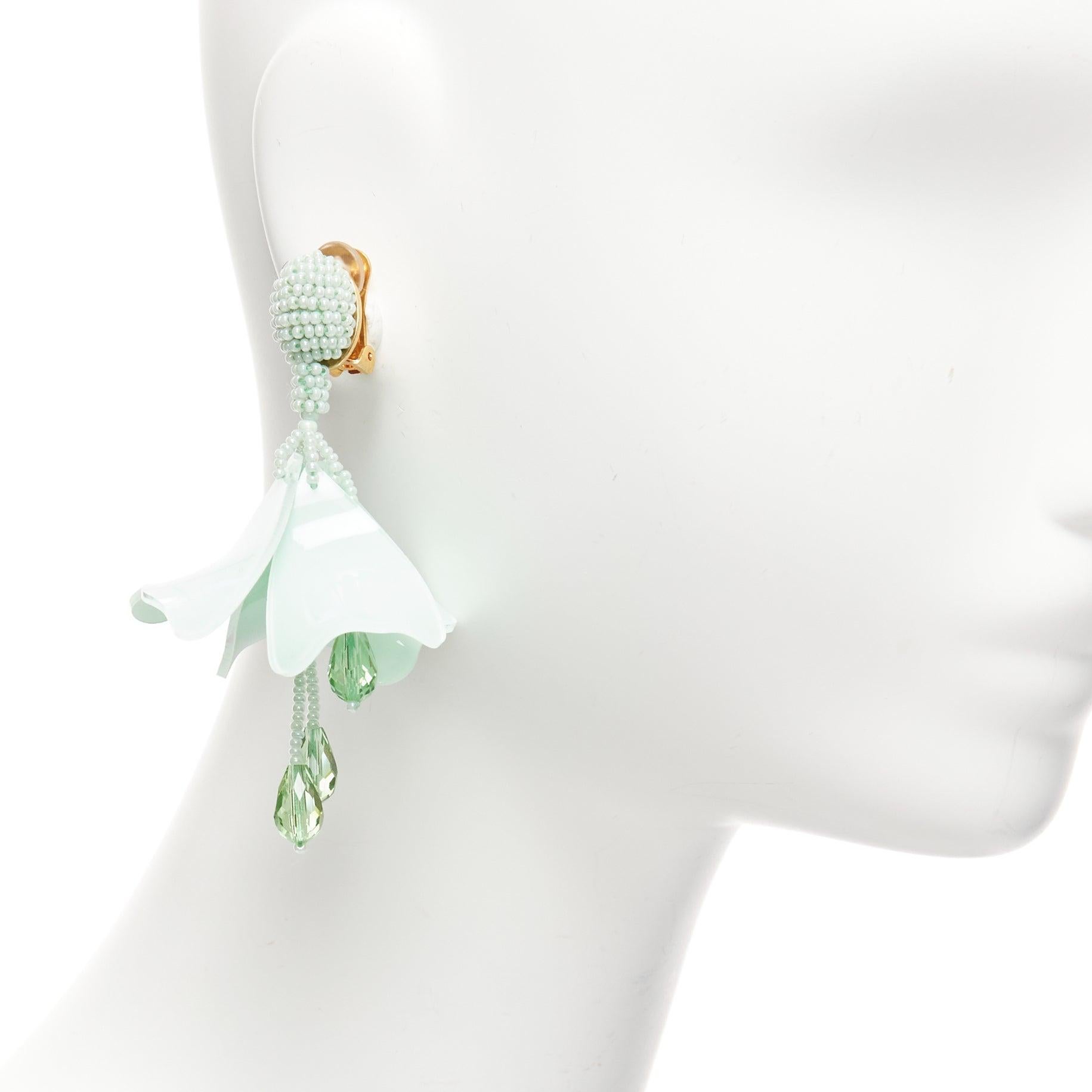 OSCAR DE LA RENTA mint green beaded acrylic flower dangling clip on earrings pair
Reference: AAWC/A01050
Brand: Oscar de la Renta
Material: Acrylic, Metal
Color: Green, Gold
Pattern: Solid
Closure: Clip On
Lining: Gold Metal
Made in: