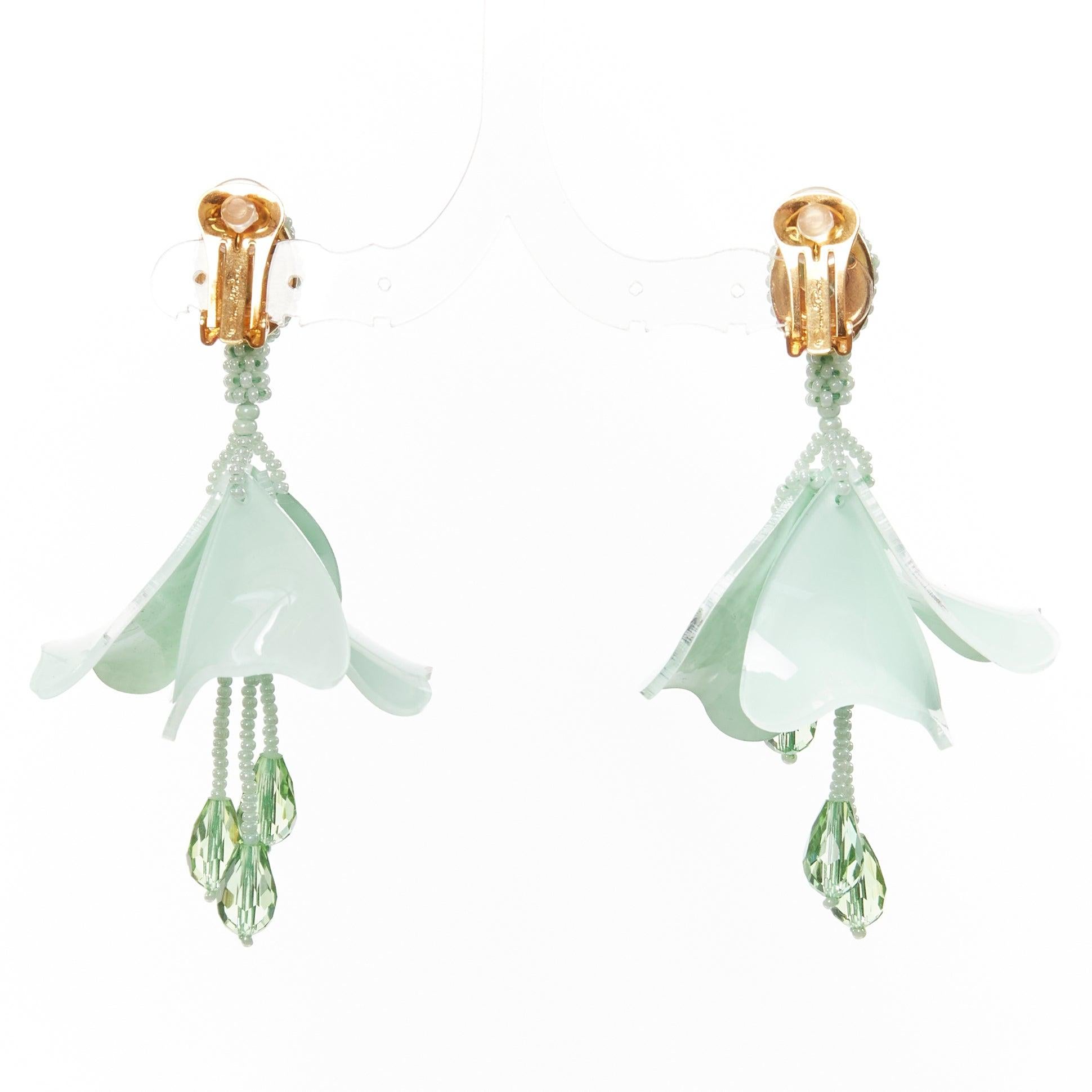 Women's OSCAR DE LA RENTA green beaded acrylic flower dangling clip on earrings pair For Sale